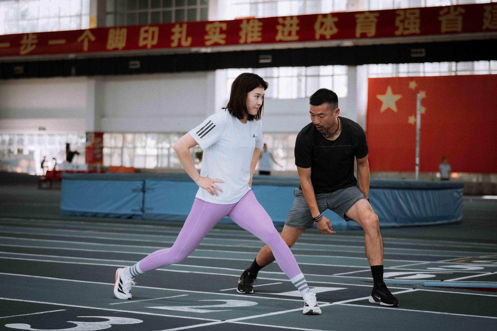 Ivan Ho working with China’s multiple-time 100m hurdles champion Wu Yanni. Photo: Ivan Ho