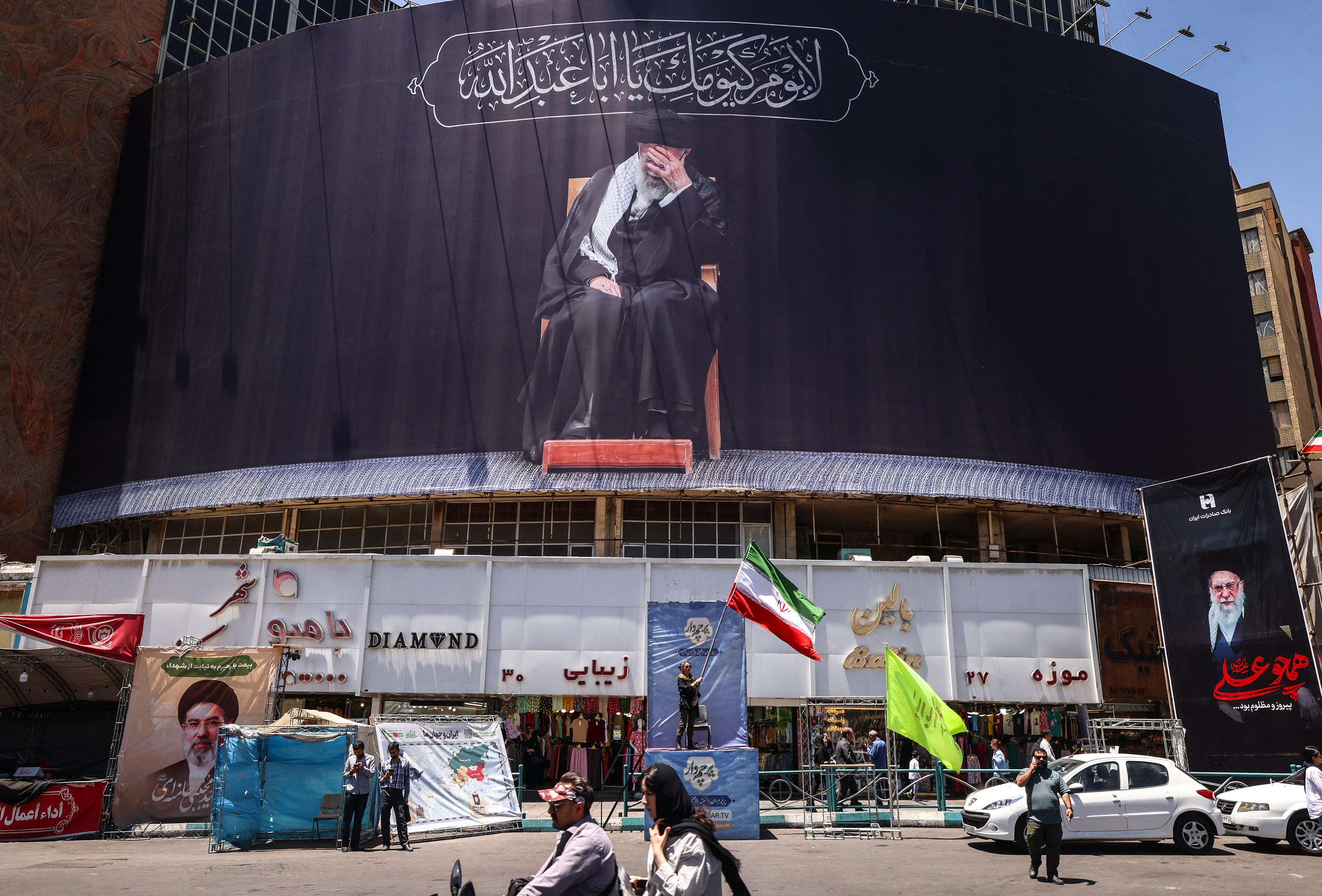 An Iranian woman waves a national flag in Tehran on Monday. Photo: AFP/Getty Images/TNS