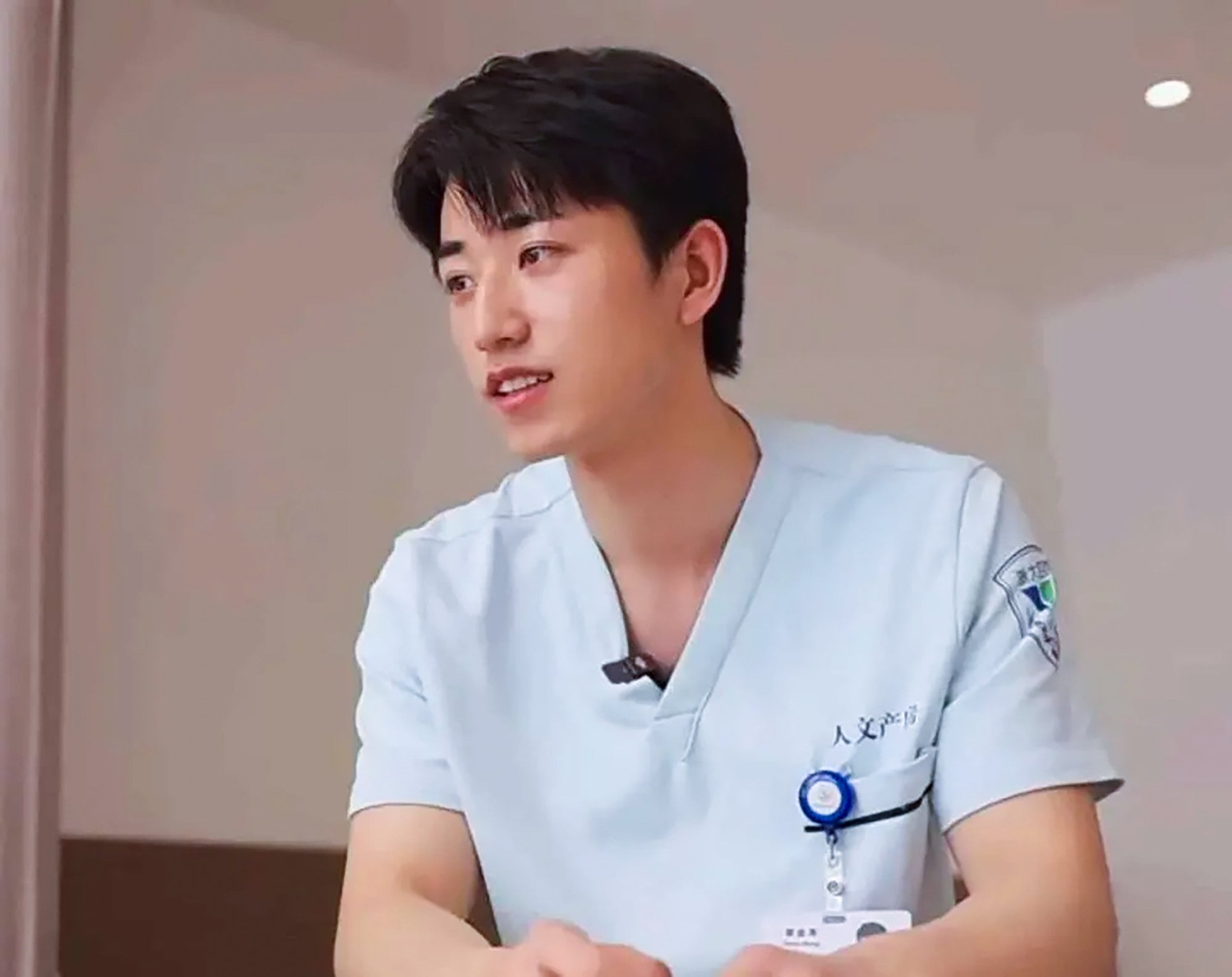 Zhang, above, photographed in his midwife’s uniform. Photo: Weixin Zhang, above, photographed in his midwife’s uniform. Photo: Weixin