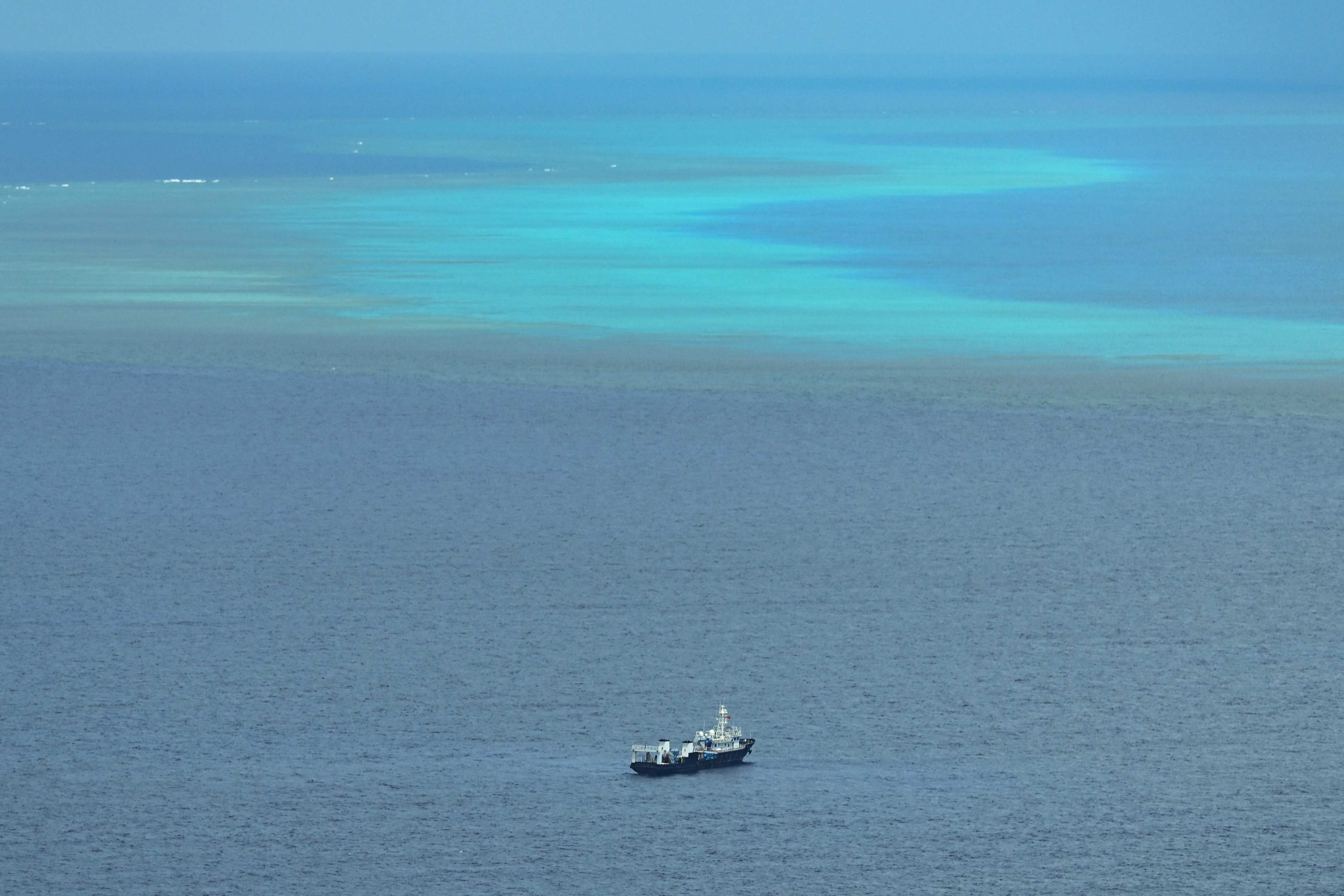 A ship identified by the Philippine Coast Guard as Chinese maritime militia is seen near Scarborough Shoal in the disputed South China Sea on Monday. Photo: AFP