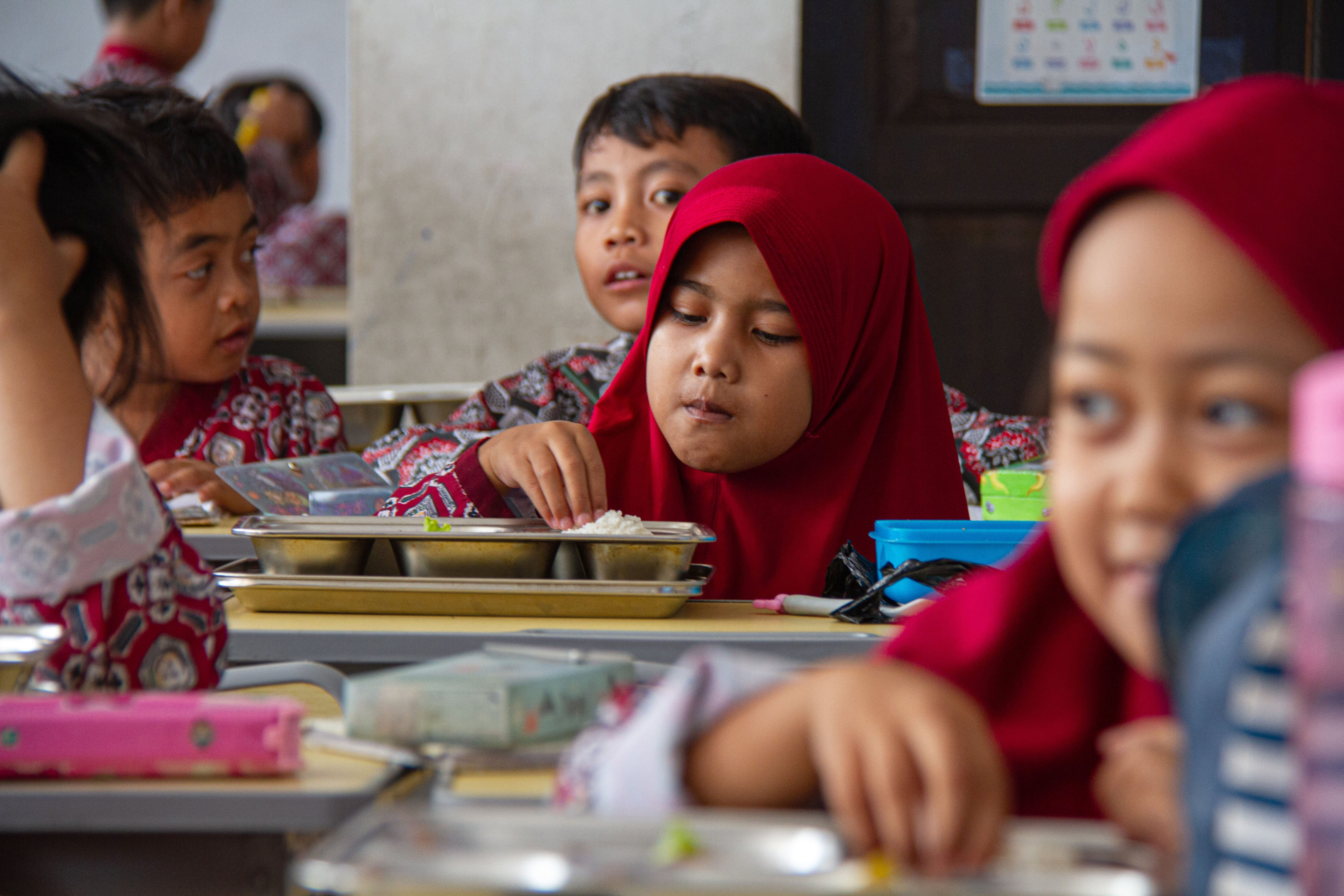 Students eat lunch provided by the Free Nutritious Meals programme in Bandung, West Java, on Friday. Photo: Xinhua