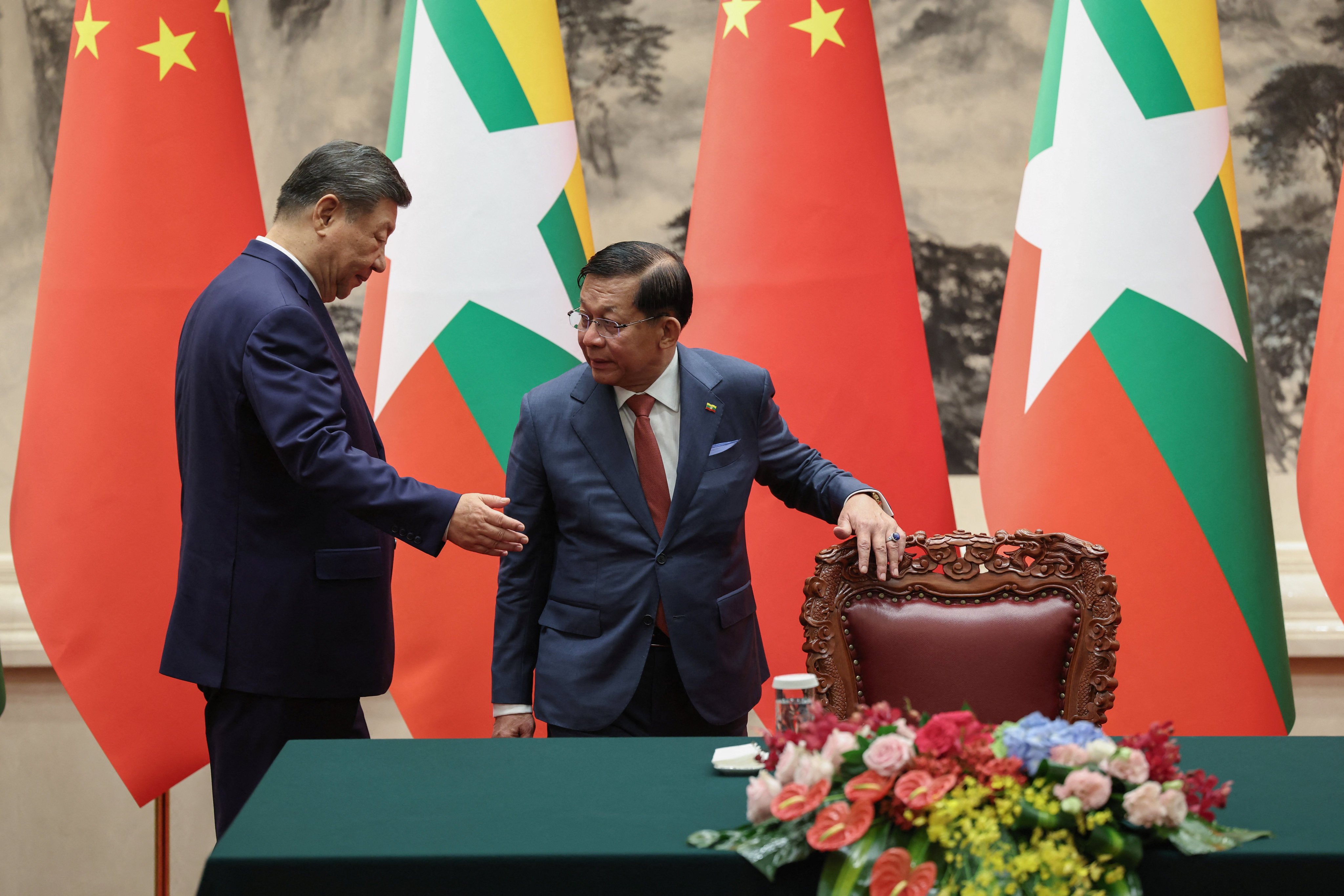 Xi Jinping and Min Aung Hlaing arrive for a signing ceremony at the Great Hall of the People on June 16, 2026 in Beijing, China. Photo: Pool via Reuters