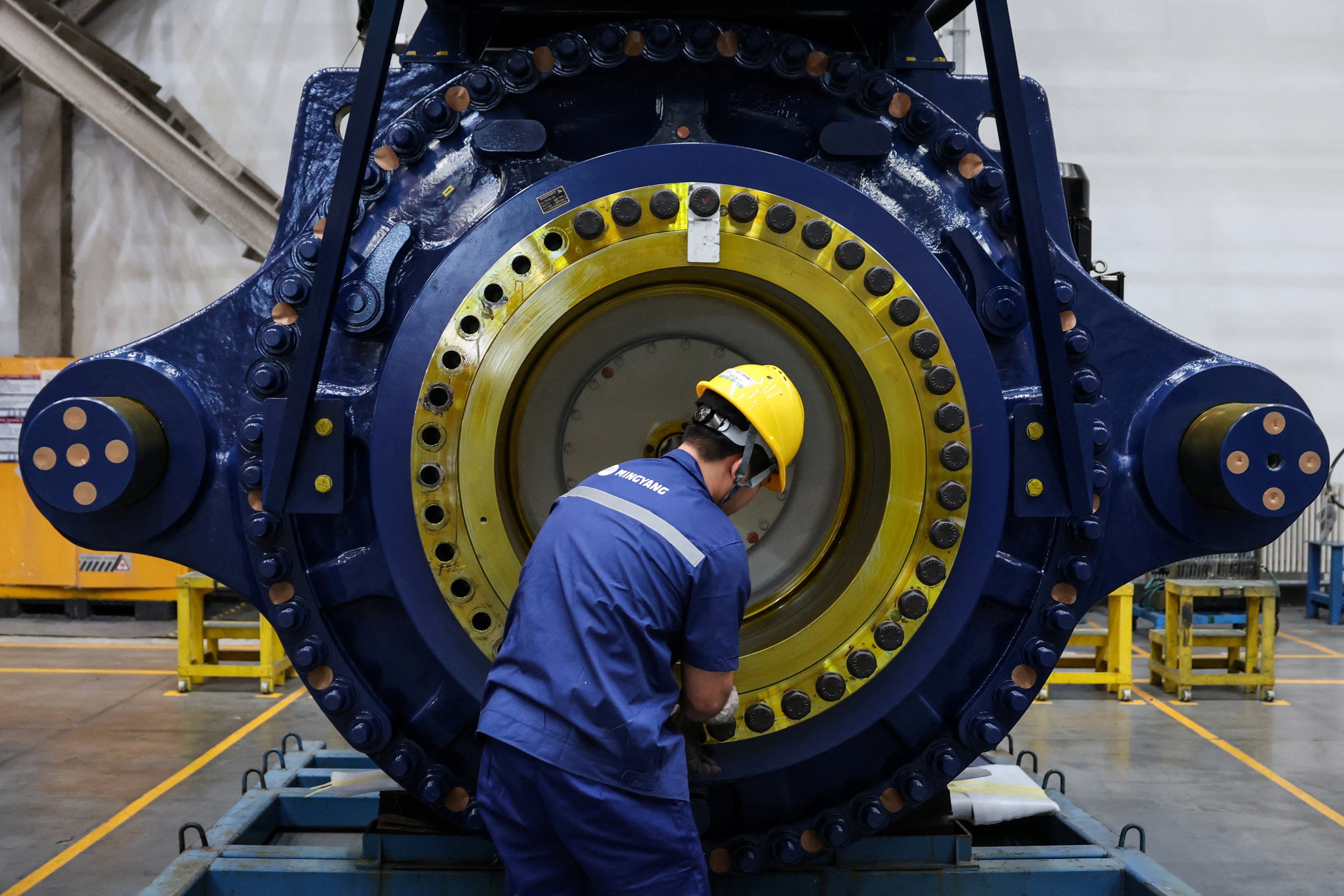 A worker assembles a wind turbine generator at Ming Yang Smart Energy Group’s industrial estate in Baotou, Inner Mongolia autonomous region, on Saturday. Photo: Reuters