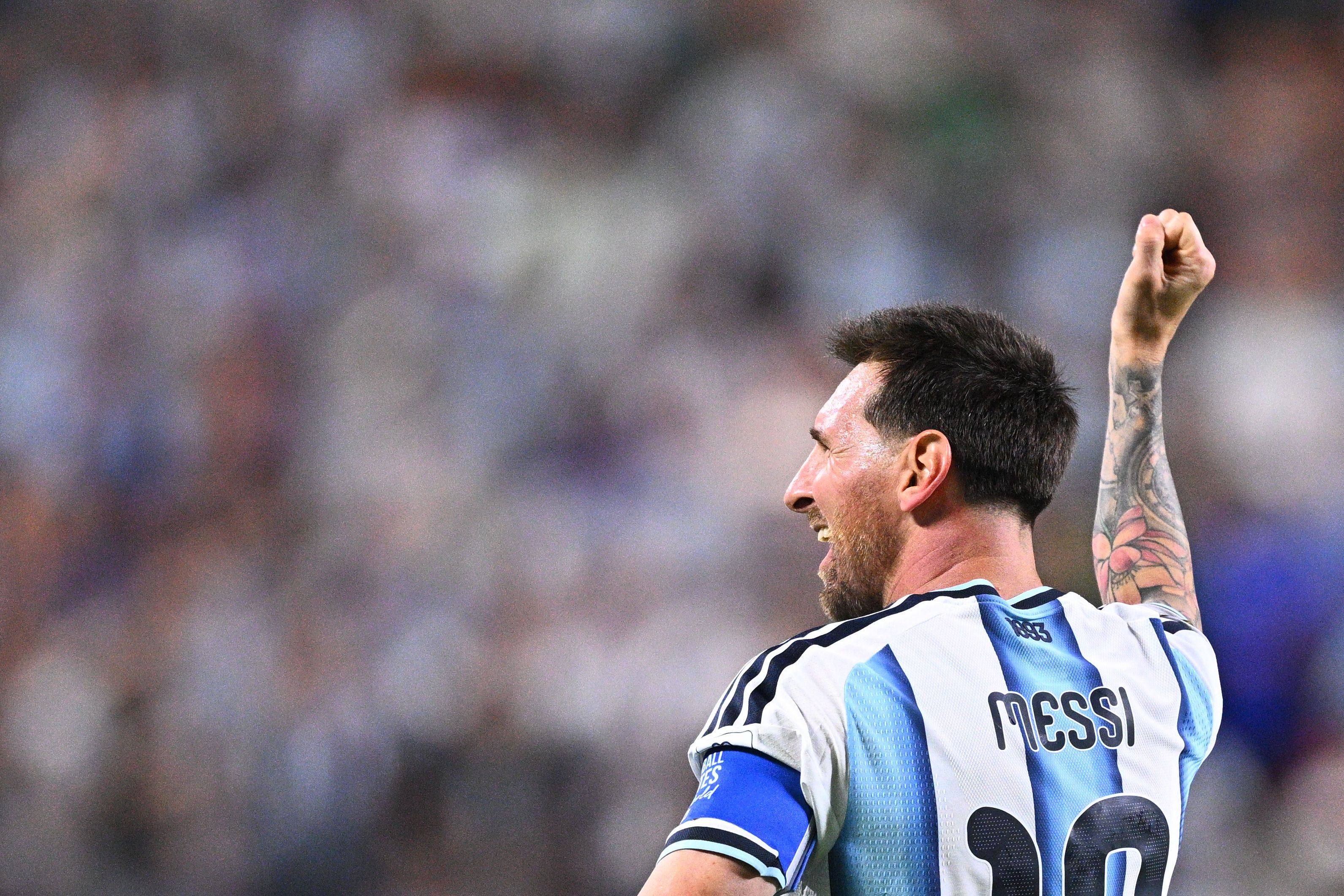 Lionel Messi celebrates after scoring his side’s second against Algeria. Photo: dpa