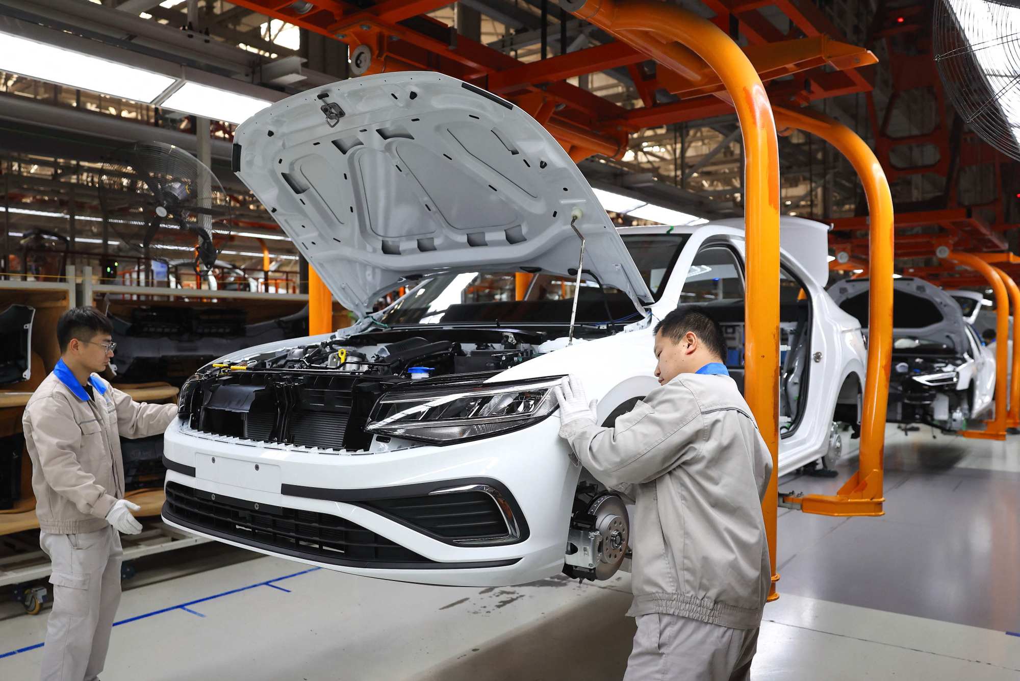 Workers assemble vehicles on a production line at a FAW-Volkswagen factory in Qingdao, in China’s eastern Shandong province. Volkswagen is one of Europe’s biggest corporate investors in China. Photo: AFP Workers assemble vehicles on a production line at a FAW-Volkswagen factory in Qingdao, in China’s eastern Shandong province. Volkswagen is one of Europe’s biggest corporate investors in China. Photo: AFP