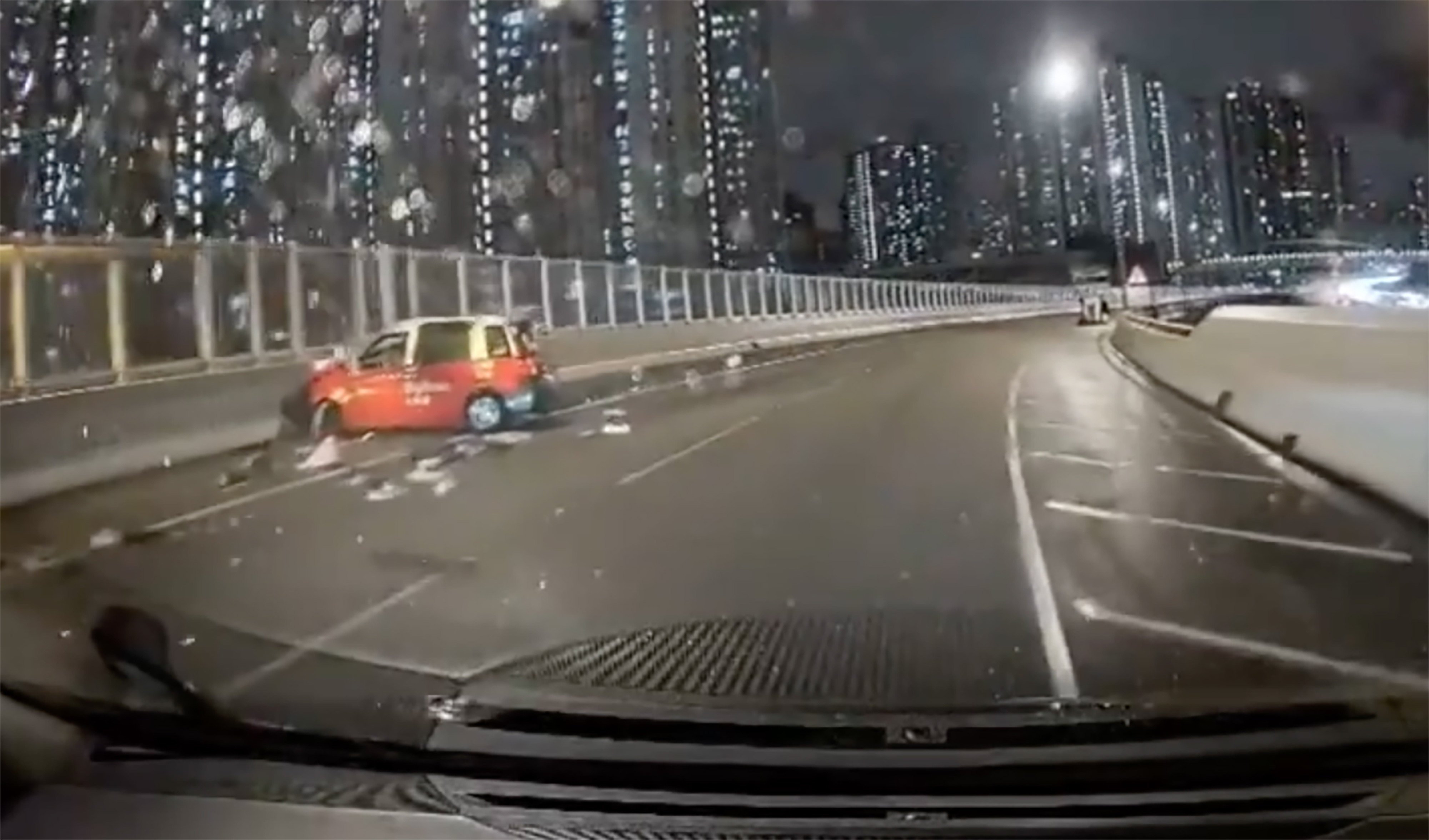 The light goods vehicle sits on its side some distance from the taxi. Photo: Handout