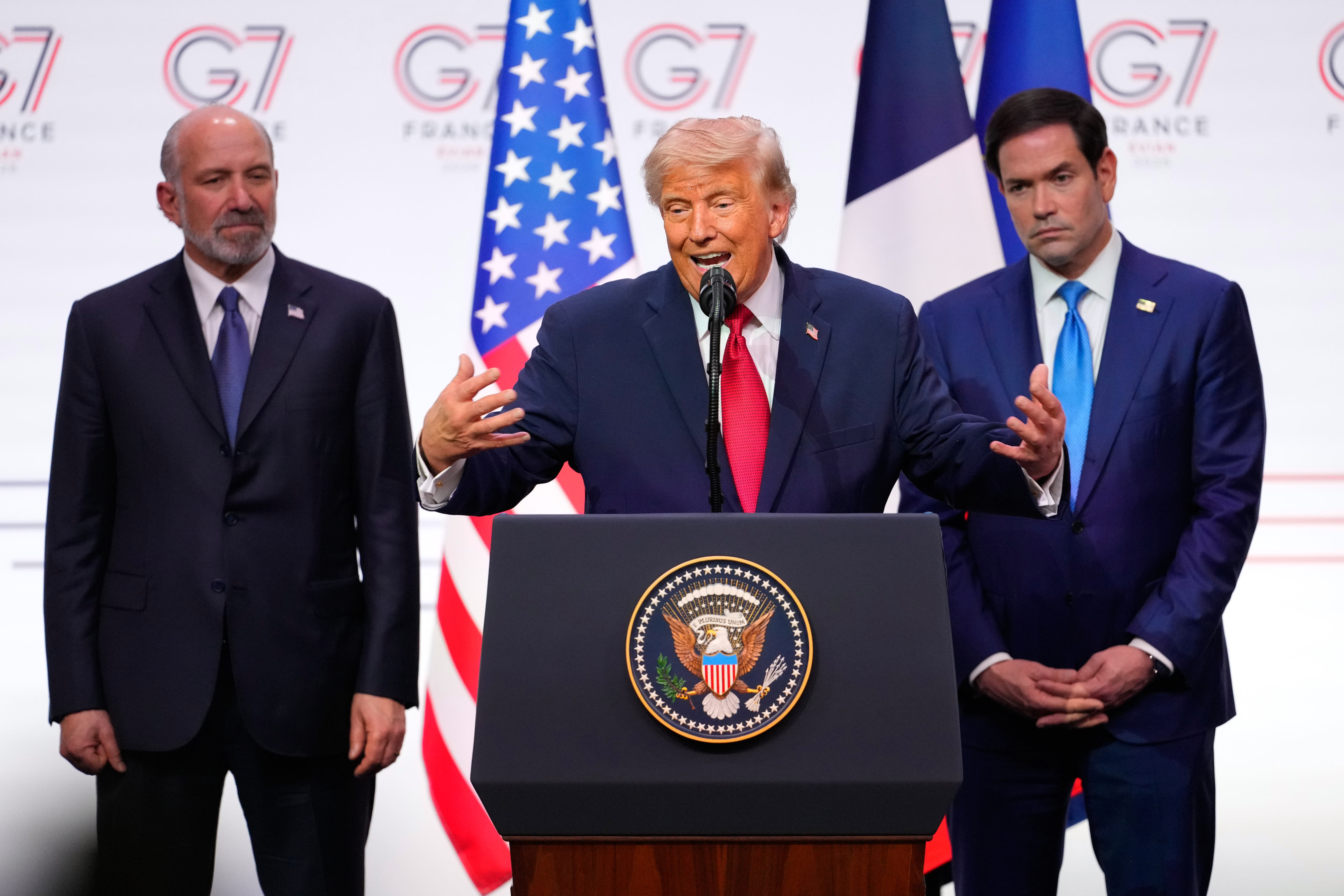 US President Donald Trump, flanked by US Secretary of Commerce Howard Lutnick and Secretary of State Marco Rubio during a media conference at the end of the G7 summit. Photo: AP