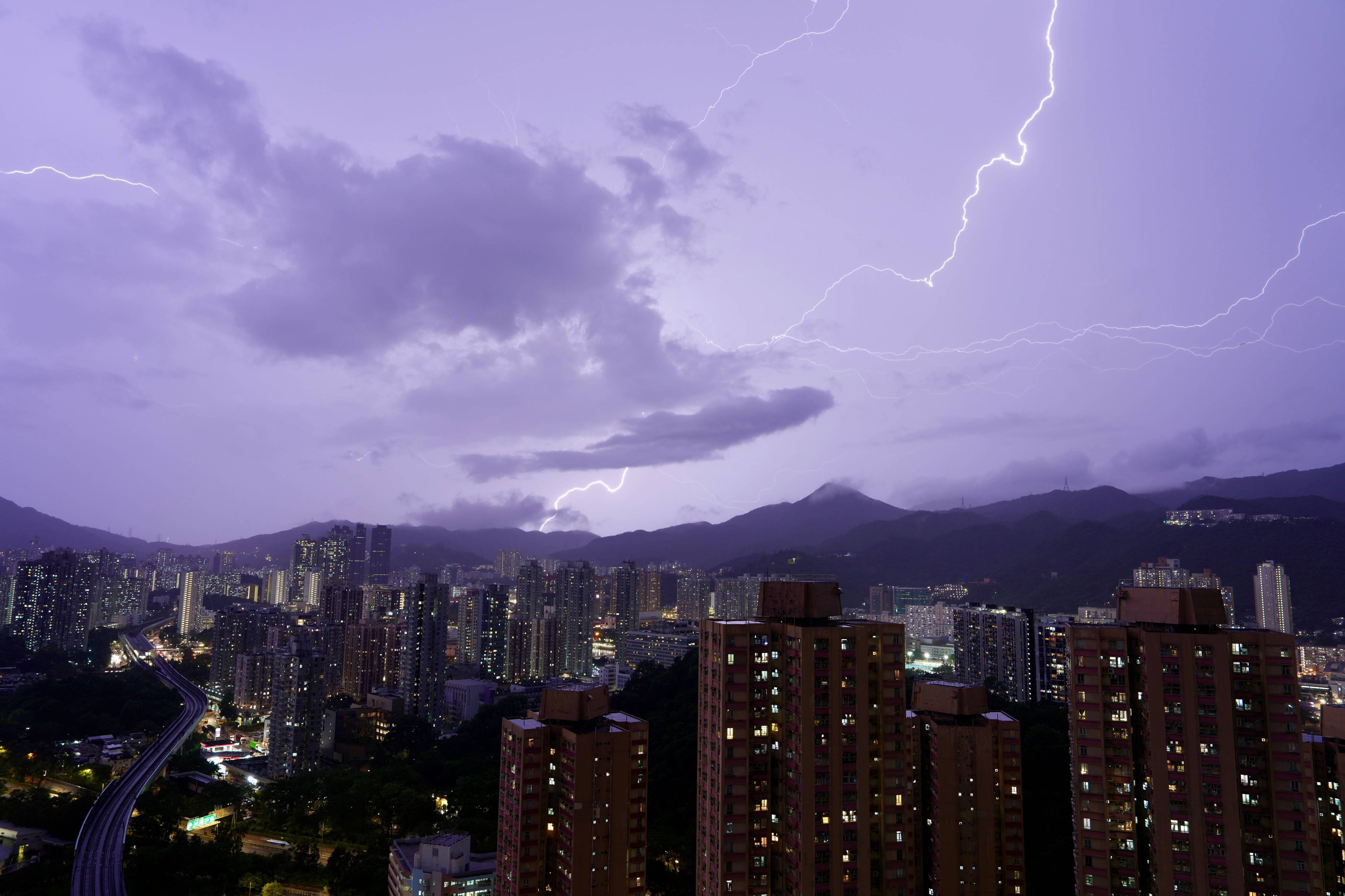 Lightning illuminates the night sky above Sha Tin on June 8. The Hong Kong Observatory issued the first black rainstorm warning of the year for an hour on June 8. Photo: Sam Tsang