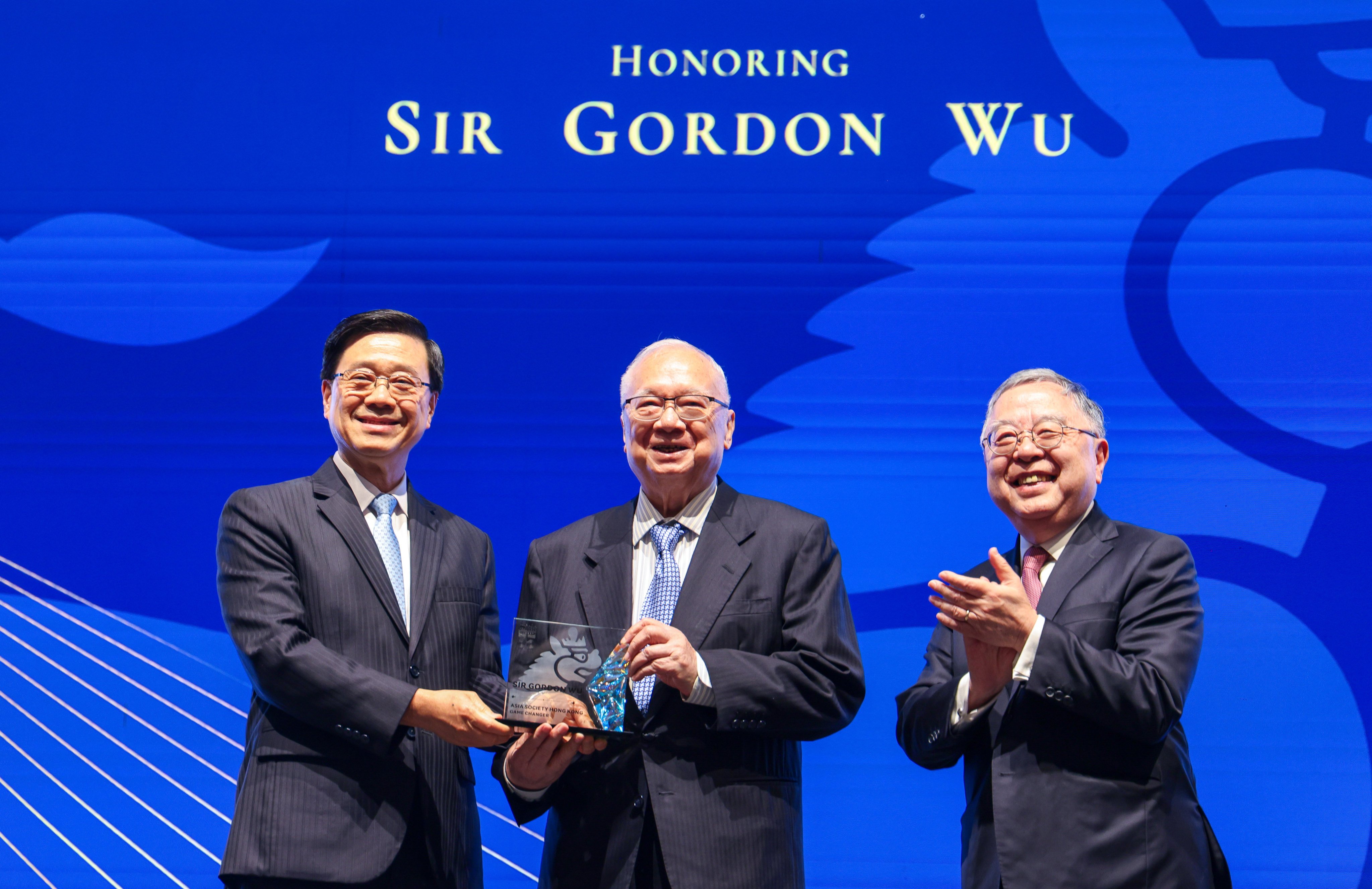 (From left) Hong Kong leader John Lee with Hopewell Holdings chairman Gordon Wu and Asia Society Hong Kong chairman Ronnie Chan  Chi-chung at the Hopewell Hotel in Wan Chai on Thursday. Photo: Nora Tam