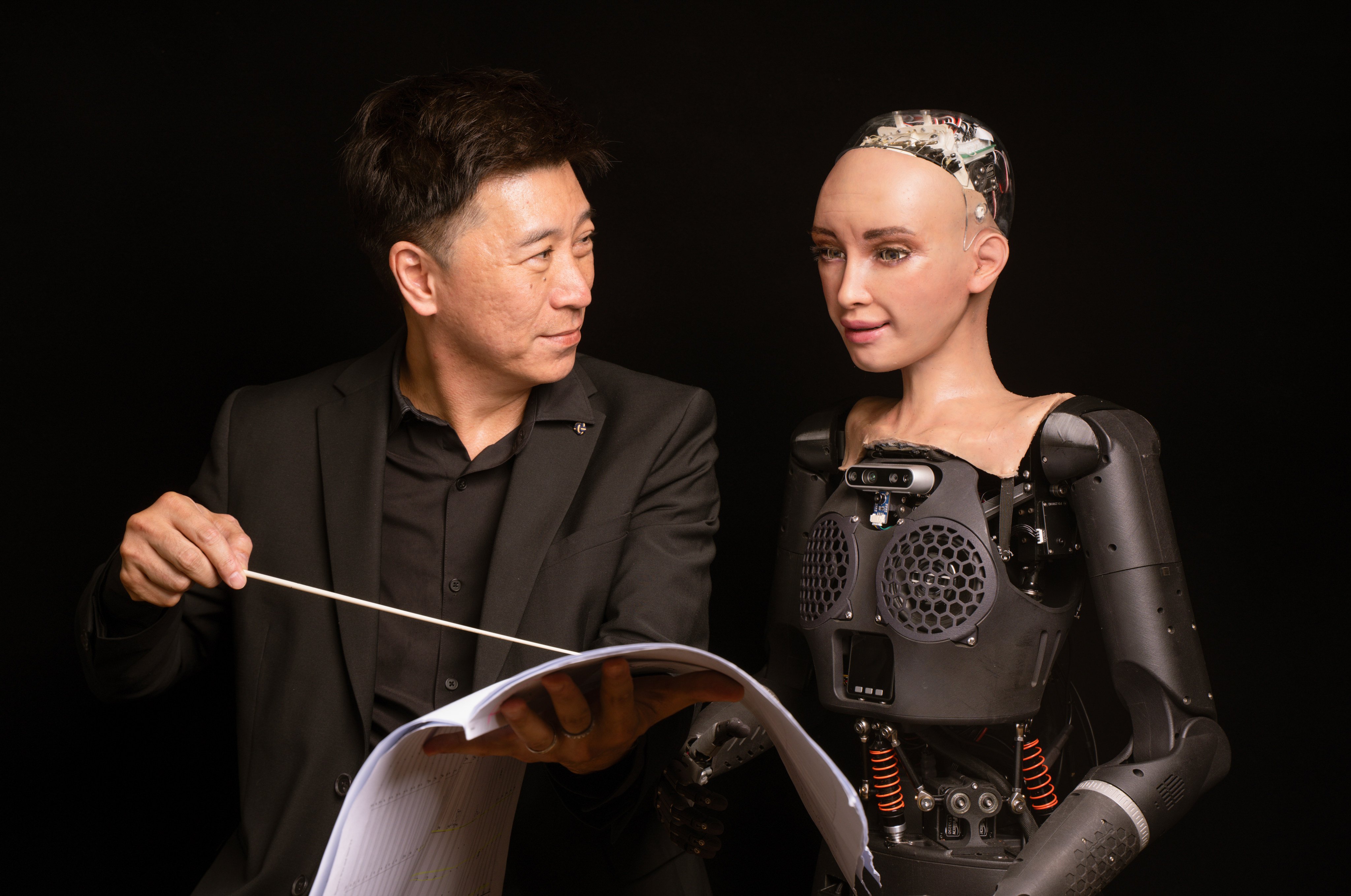 Sophia the singing robot and Johnny Poon, conductor and dean of creative arts at the Hong Kong Baptist University. Photo: Alexander Mak
