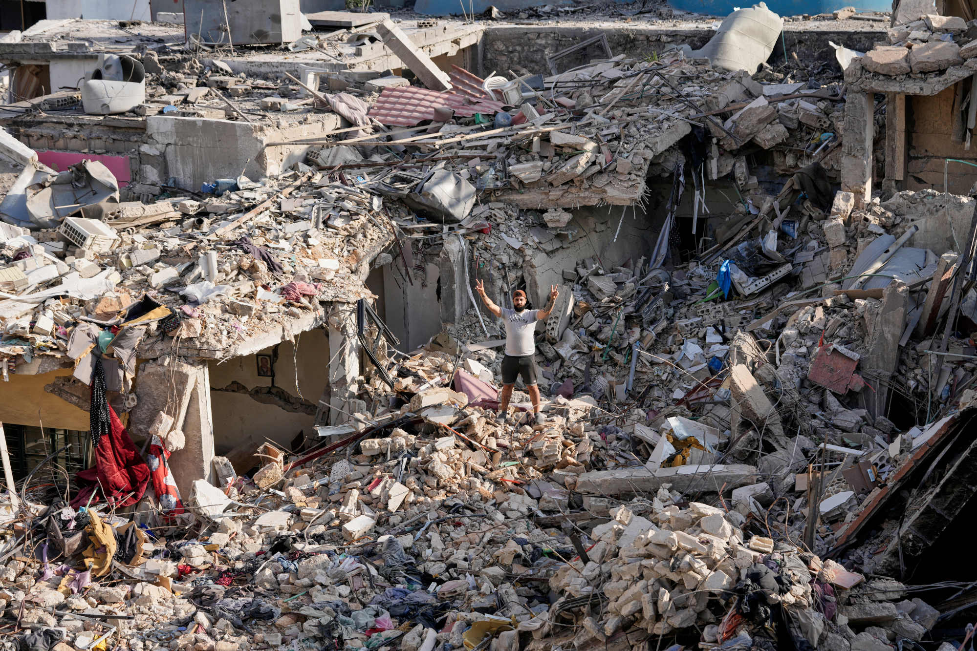 A man stands on the rubble of his destroyed house in Nabatiyeh town, southern Lebanon. Photo: AP