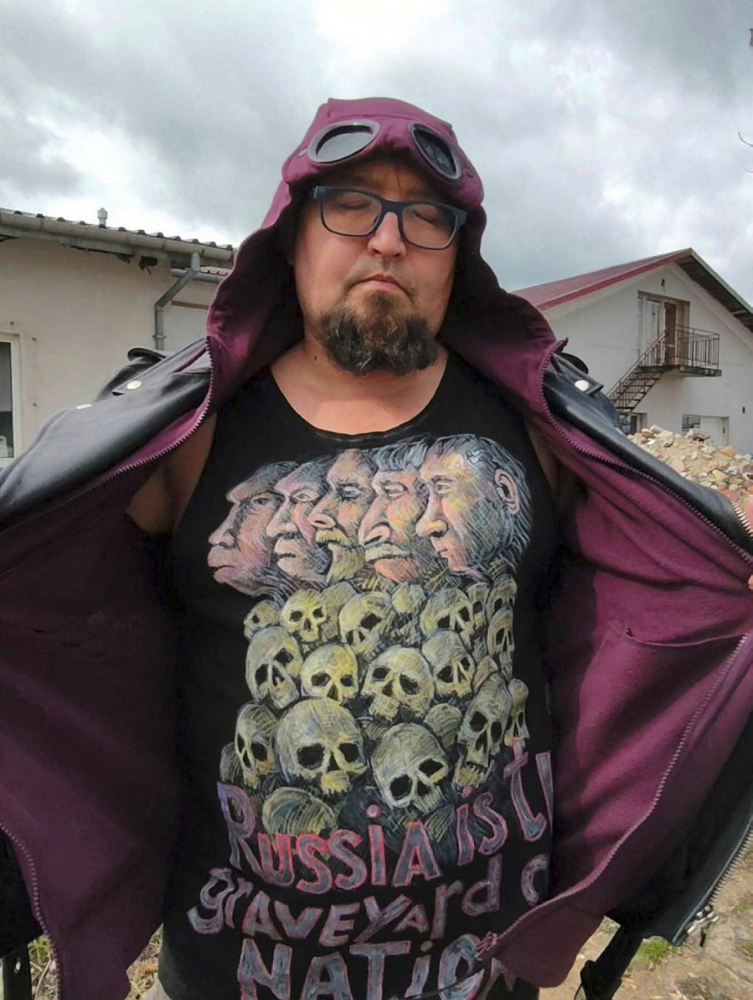 Russian artist Robert Kuzovkov, also known by his artistic pseudonym Semyon Skrepetsky, shows off a T-shirt with one of his works. Photo: Facebook/Reuters
