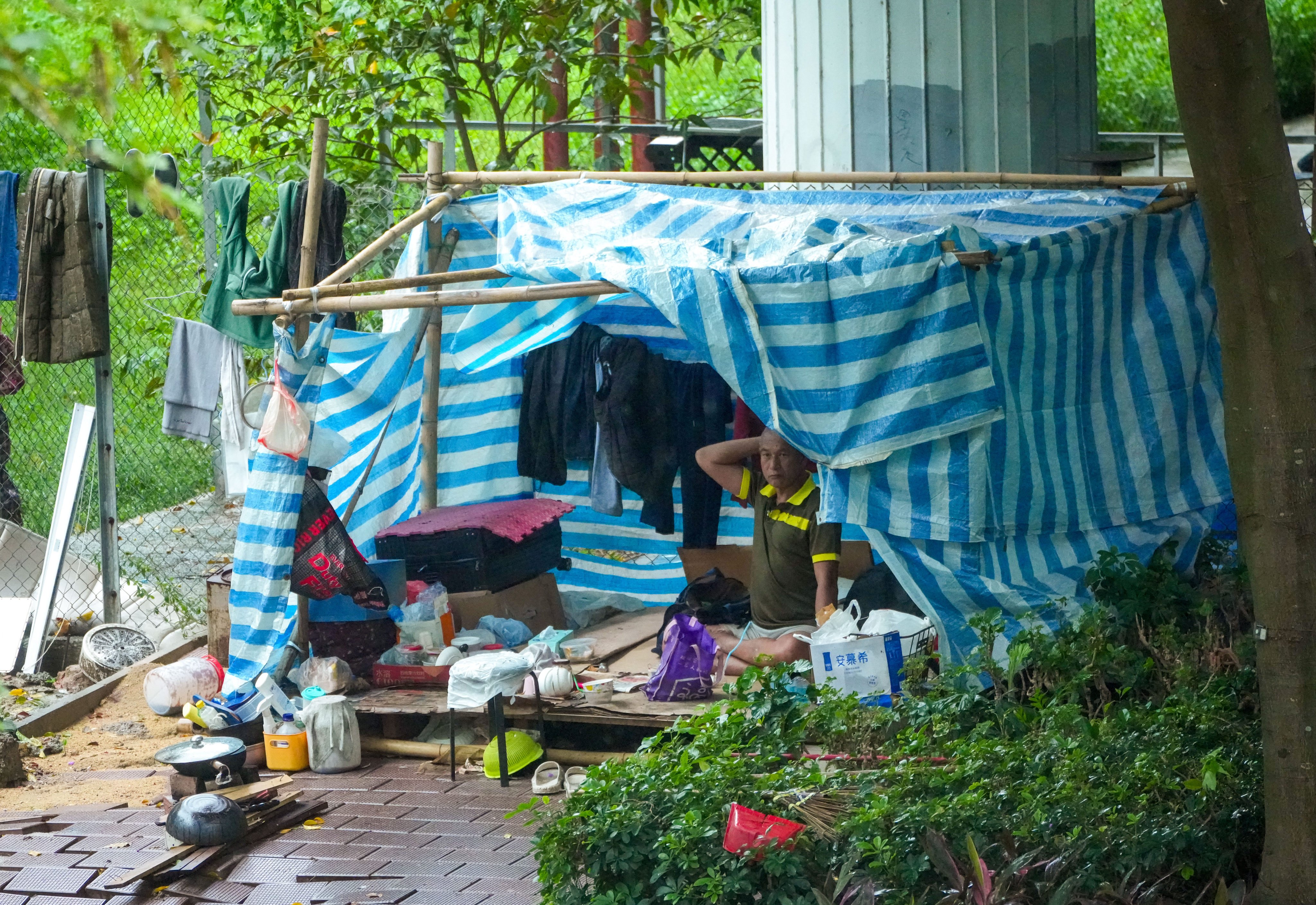 A man rests in a makeshift shelter in Mong Kok. Photo: Dickson Lee