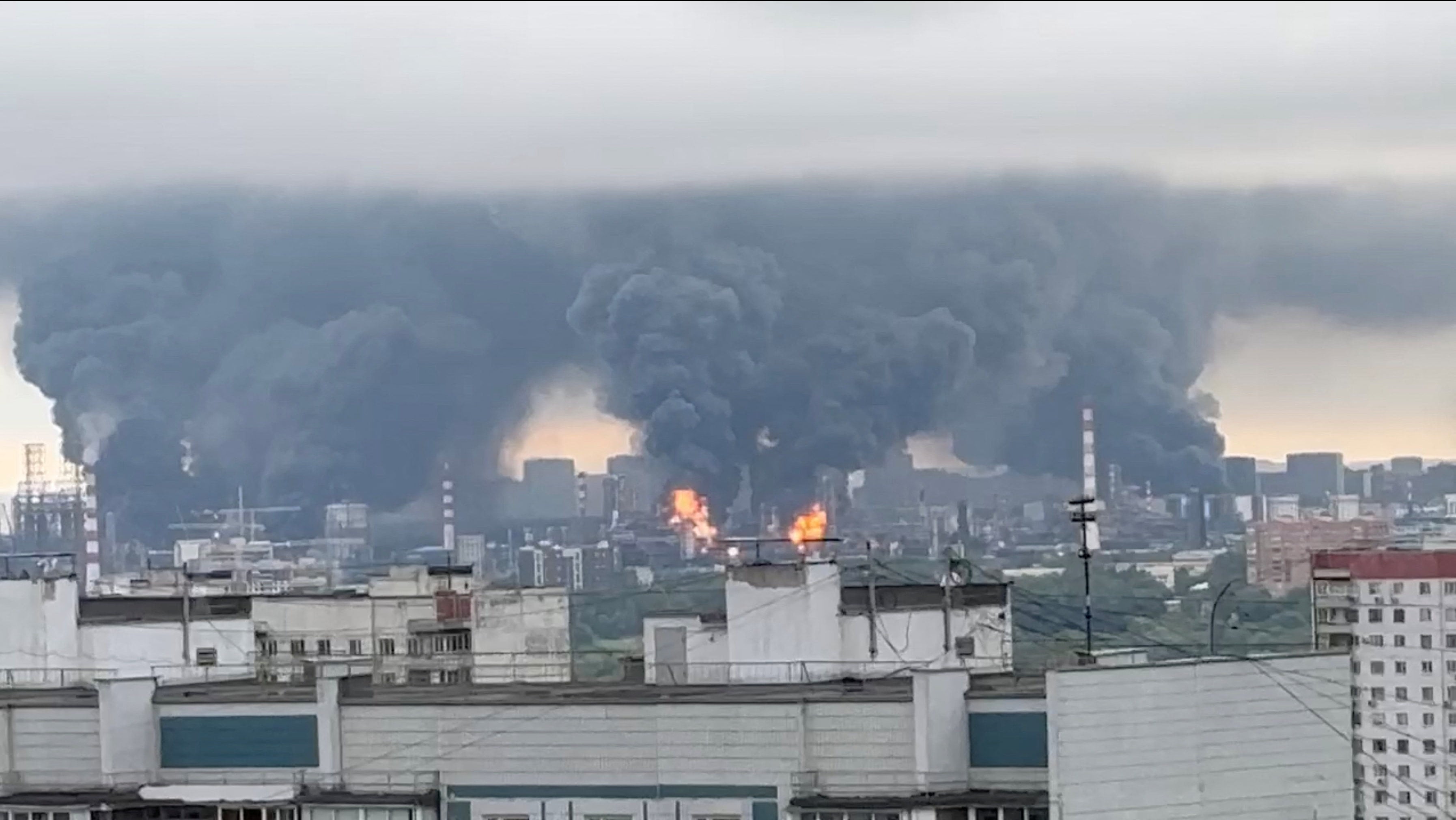 Thick plumes of smoke and flames rise from an oil refinery in Moscow on Thursday. Photo: Social media via Reuters