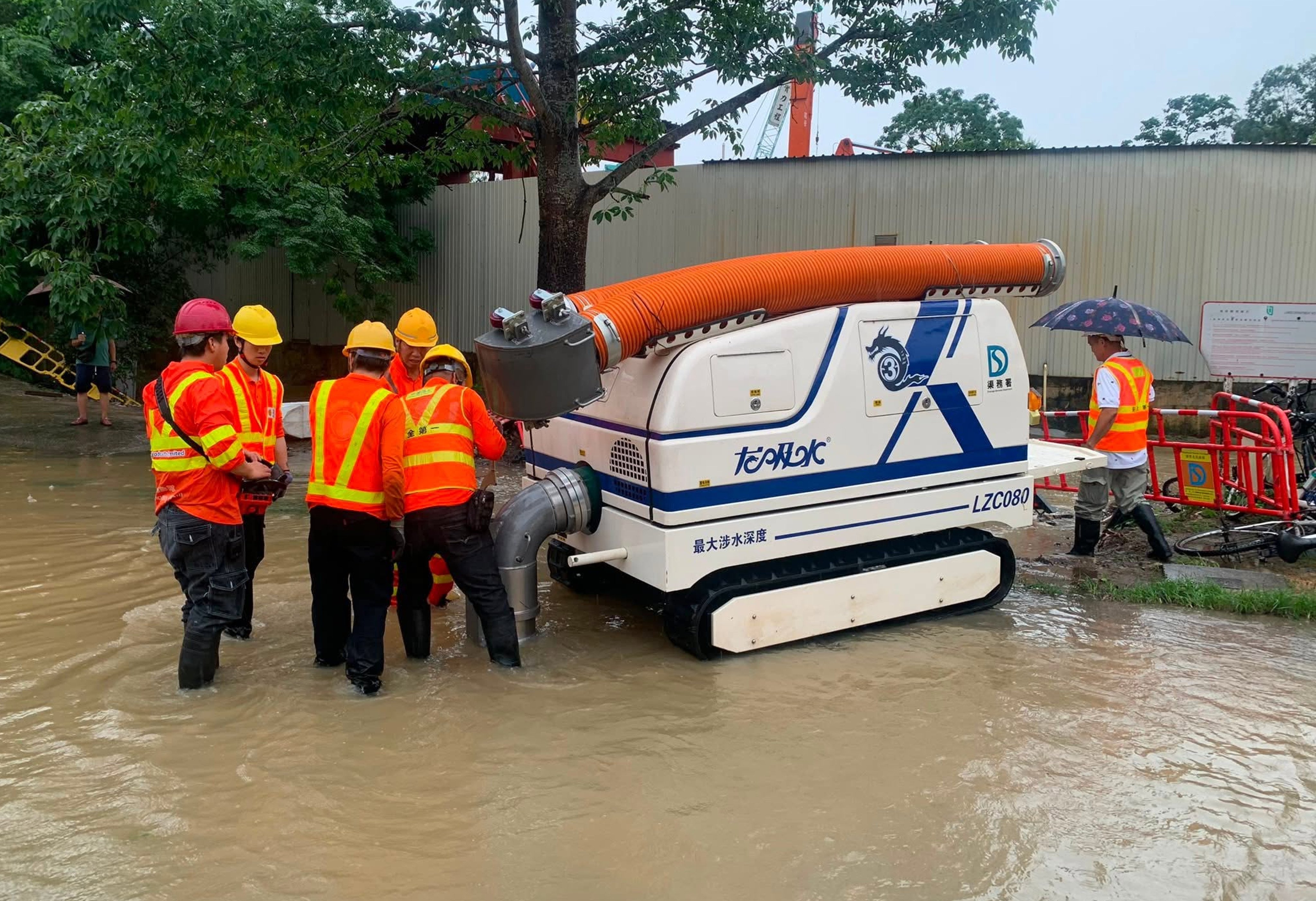 Emergency teams deploy drainage robots, known as “water-pumping dragons”. Photo: Handout