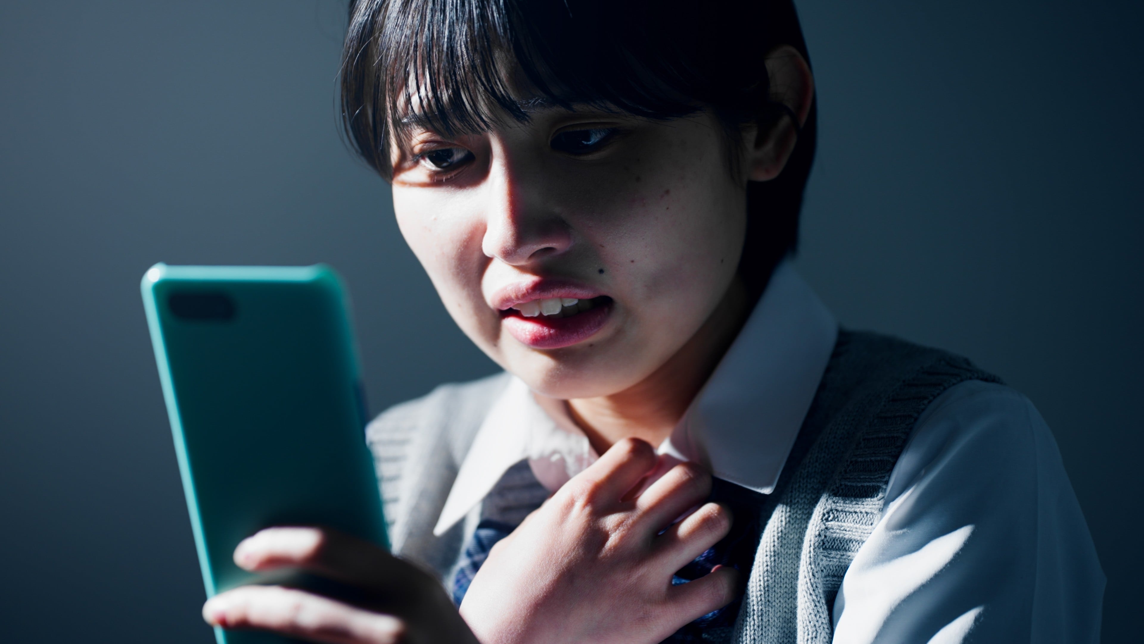 A Japanese high school student checks her smartphone. A Cabinet Office study released on May 1 reveals that more than half of teenage girls in Japan had used AI asked for advice on personal problems. Photo: Shutterstock