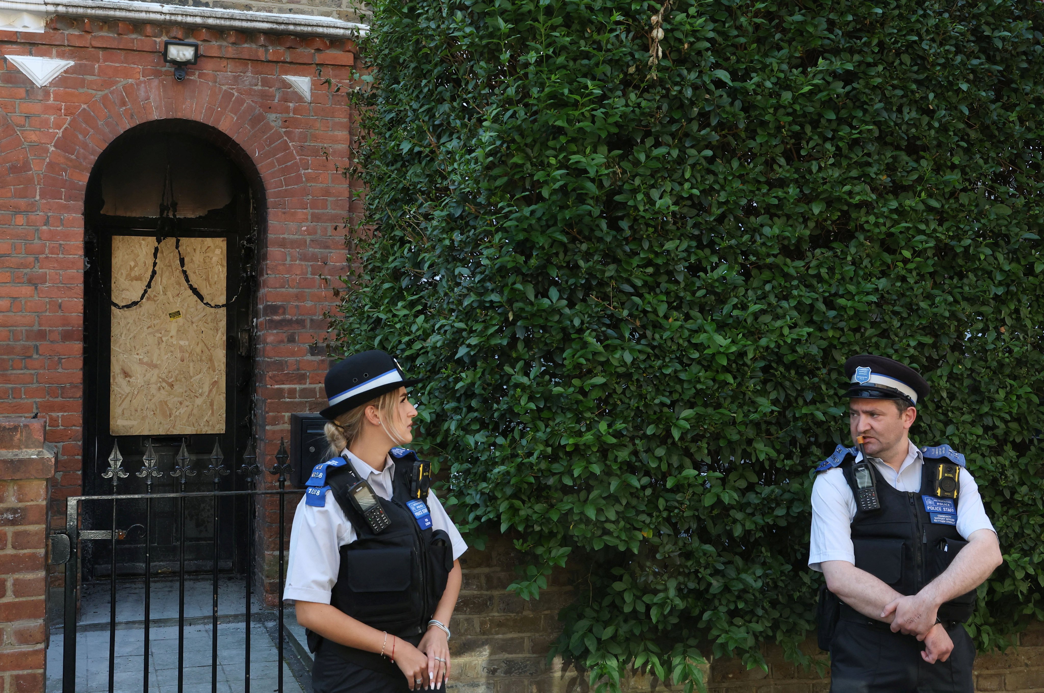 Police officers stand guard outside British Prime Minister Keir Starmer’s private home in north London after it was damaged in a suspected arson attack on May 13, 2025. Photo: Reuters