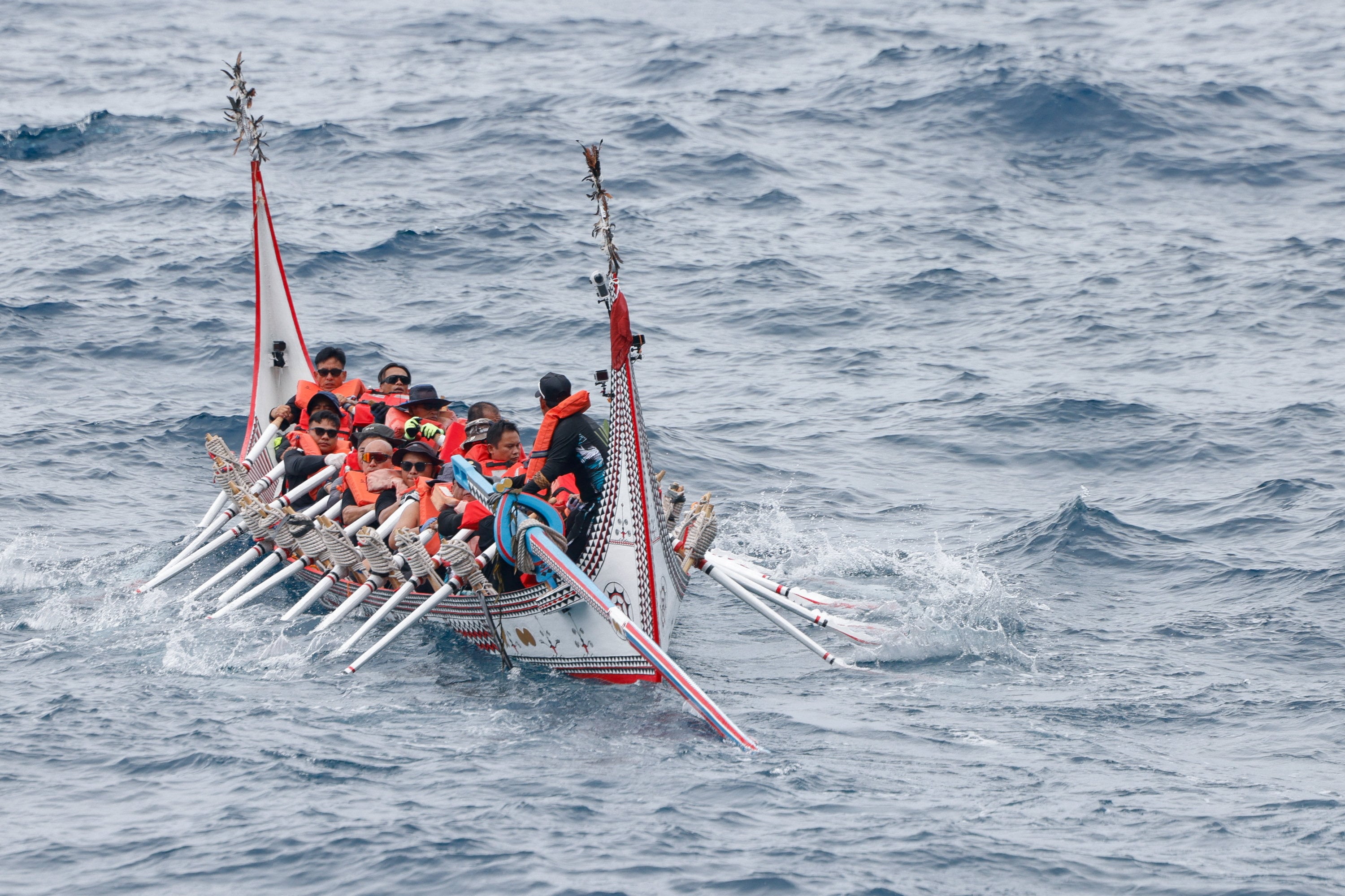 Tao indigenous rowers paddle a traditional wooden canoe named Ovayan, or "Golden Friendship," to the Philippines' Batanes Islands, on Orchid Island, Taiwan, June 15, 2026. REUTERS/Ann Wang