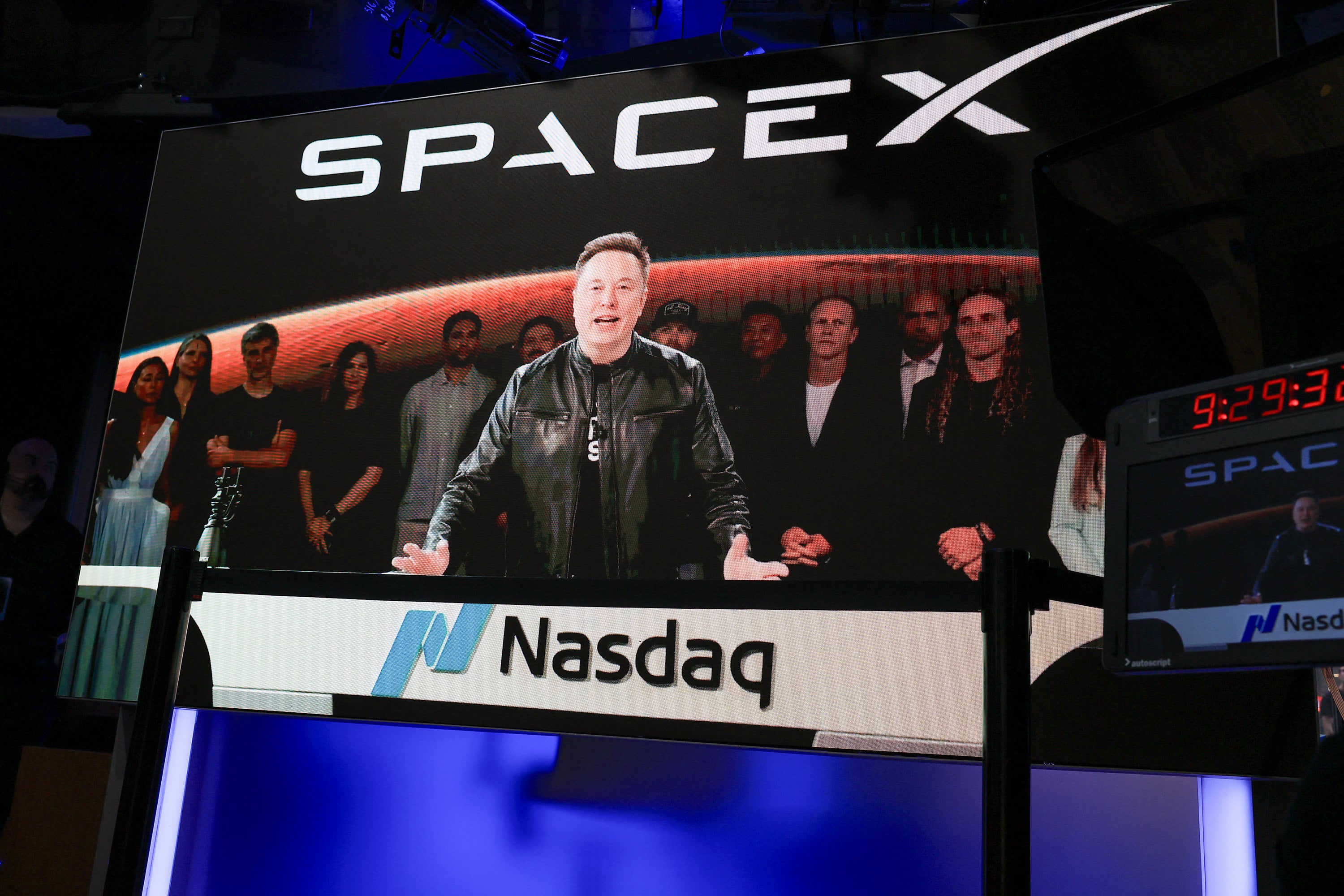SpaceX CEO Elon Musk, displayed on a screen remotely from SpaceX headquarters in Starbase, Texas, speaks before the launch of SpaceX’s IPO at the Nasdaq MarketSite in New York City on June 12. Photo: AFP / Getty Images / TNS