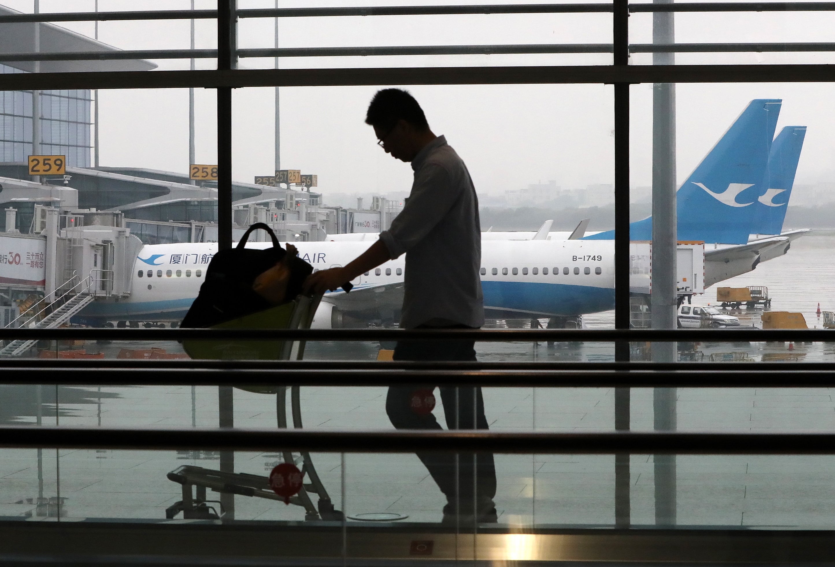 A traveller at Guangzhou Baiyun International Airport’s Terminal 2. Photo: Edward Wong