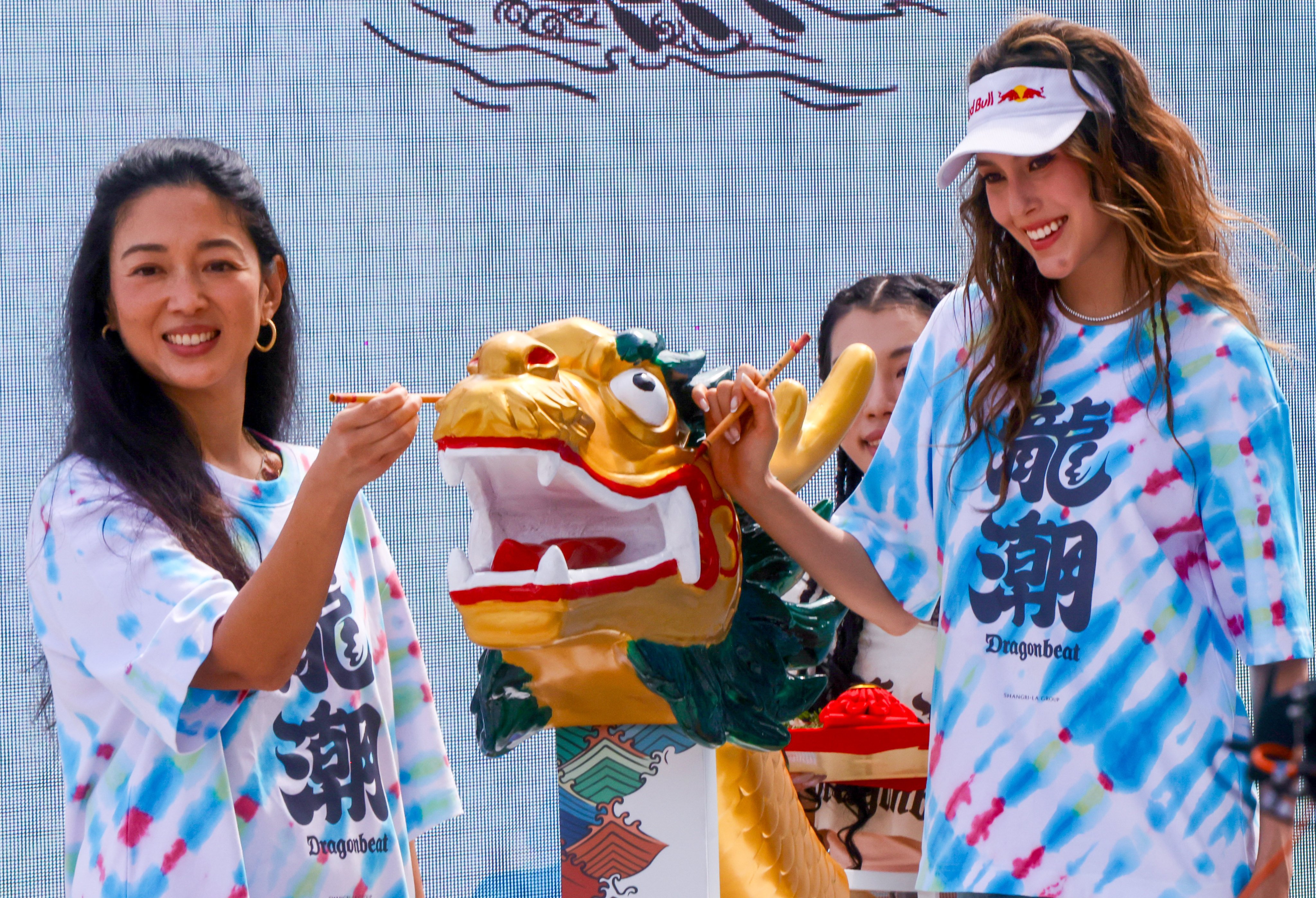 Shangri-La Group’s Kuok Hui Kwong (left) and Eileen Gu perform the traditional eye-dotting ceremony. Photo: Jonathan Wong