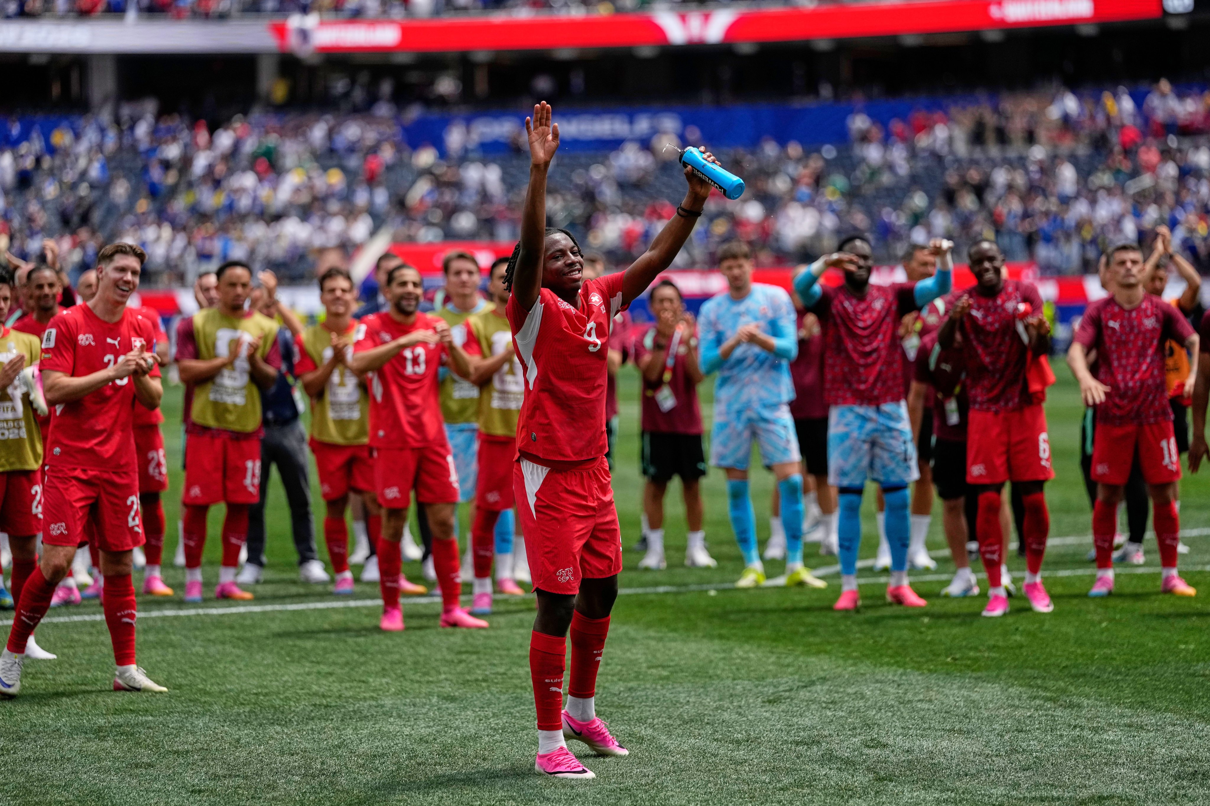 Switzerland’s Johan Manzambi salutes his side’s fans after their win over Bosnia and Herzegovina. Photo: AP