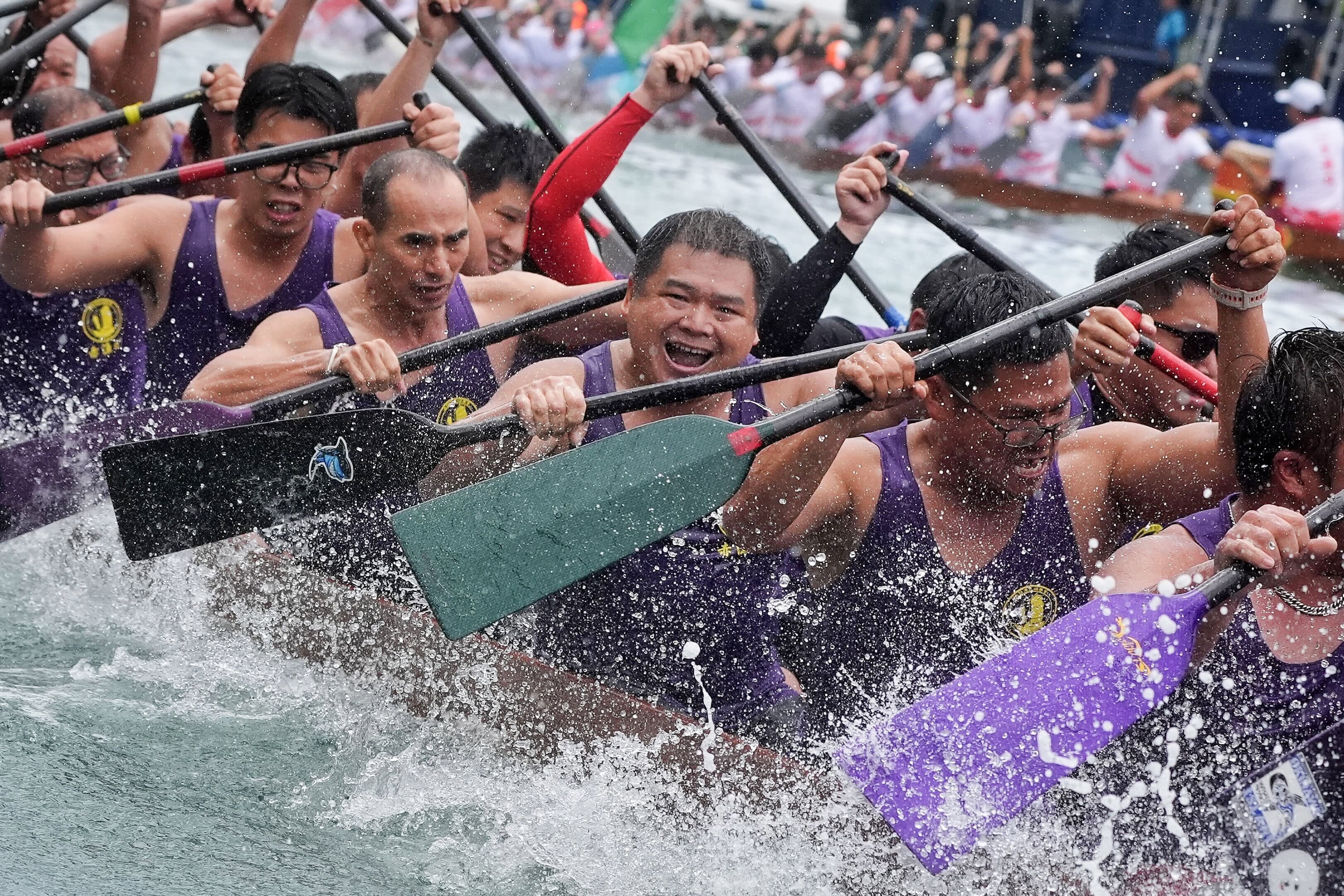 Paddlers power through the water as Hong Kong celebrates Tuen Ng Festival with dragon boat races despite recent storms. Photo: Elson Li