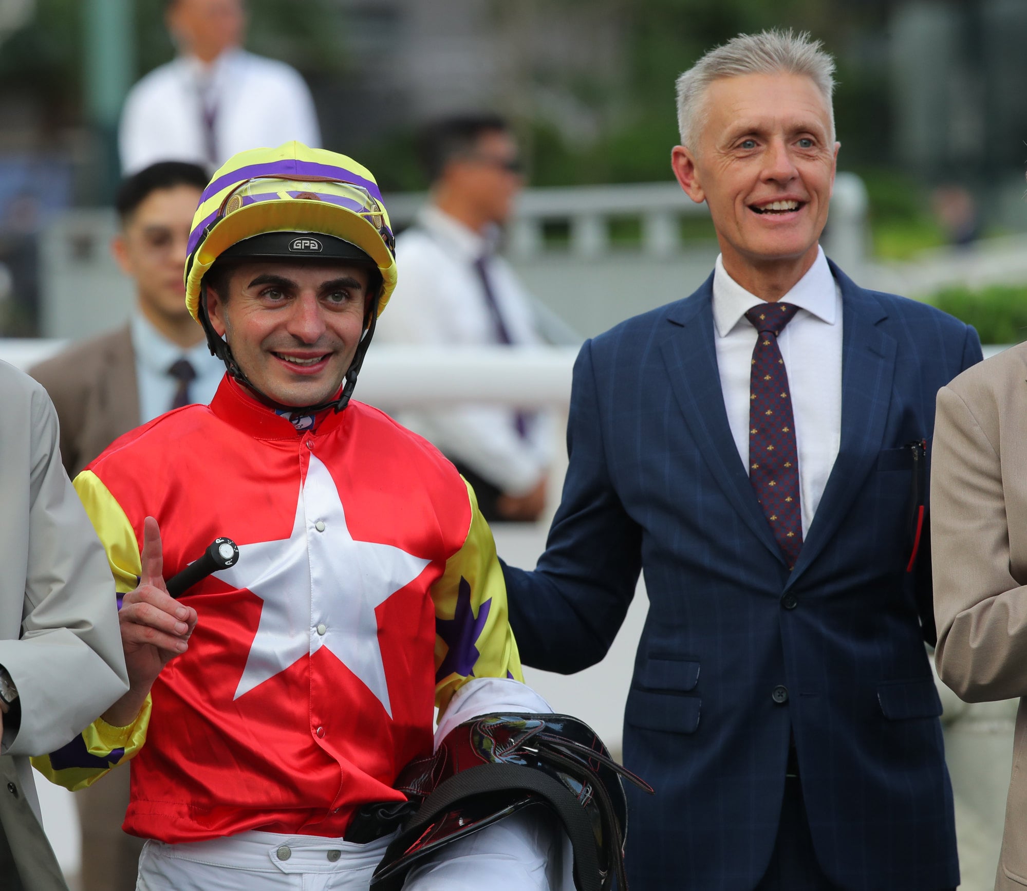 Andrea Atzeni and Mark Newnham celebrate the win of Crimson Flash at Sha Tin. Andrea Atzeni and Mark Newnham celebrate the win of Crimson Flash at Sha Tin.
