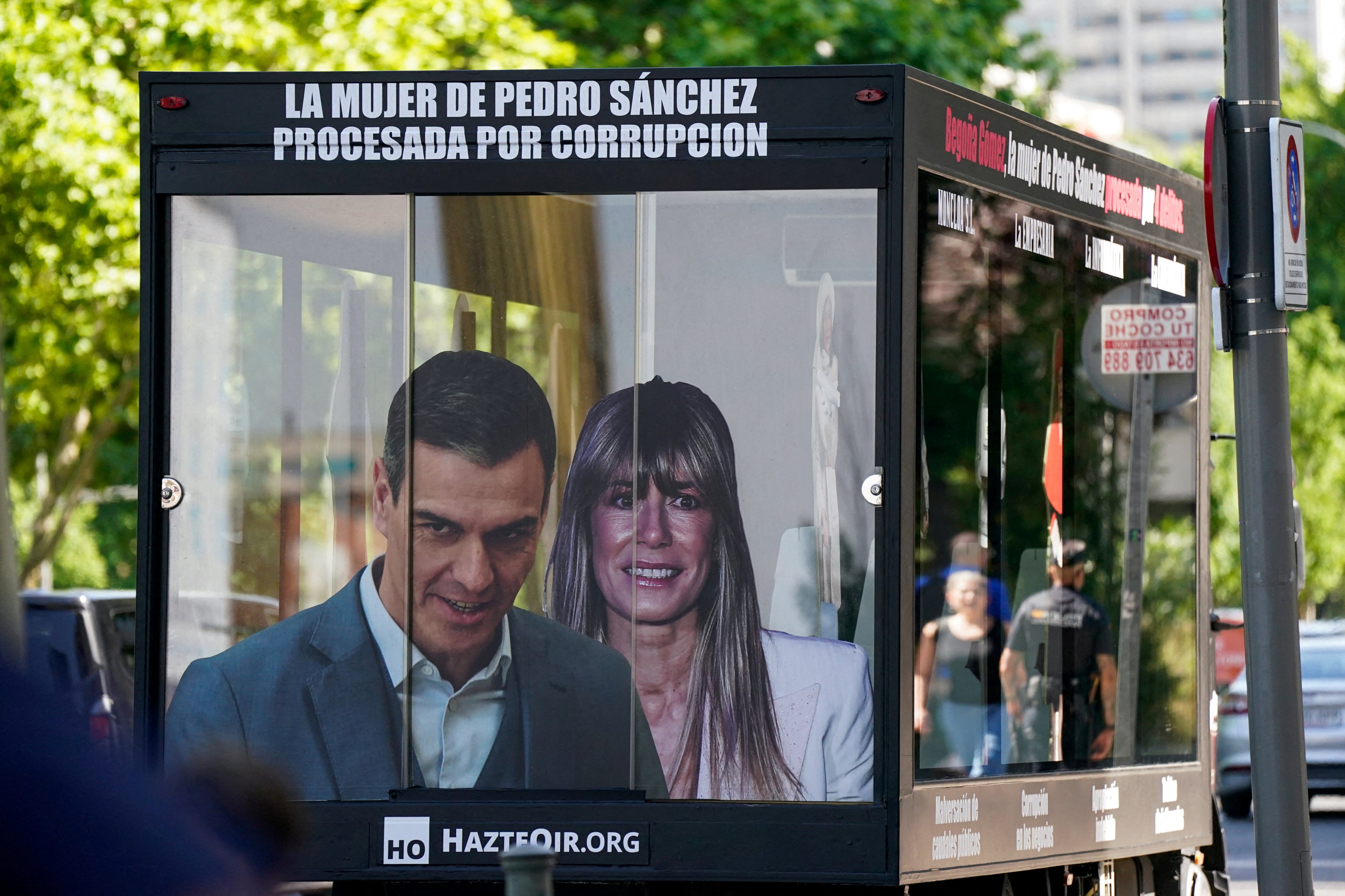 A truck displaying images of Spanish Prime Minister Pedro Sanchez and his wife Begona Gomez drives outside the court as a way of protest on the day Gomez appears in court to testify as part of influence-peddling investigation, in Madrid on Monday. Photo: Reuters