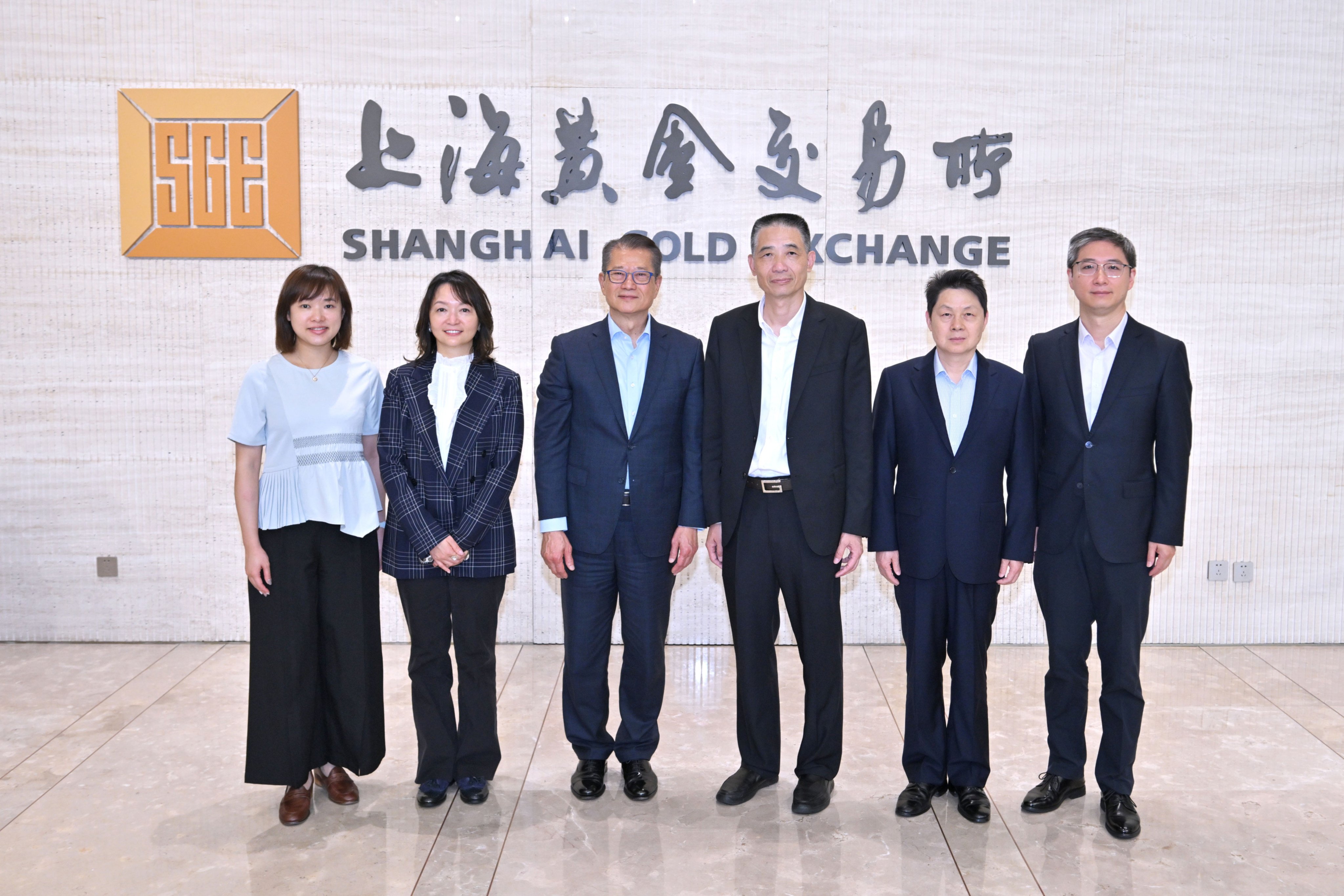 Paul Chan (third from left) with Yu Wenjian, chairman of the Shanghai Gold Exchange (third from right), and other Hong Kong and mainland government staff during his recent visit to Shanghai. Photo: Handout
