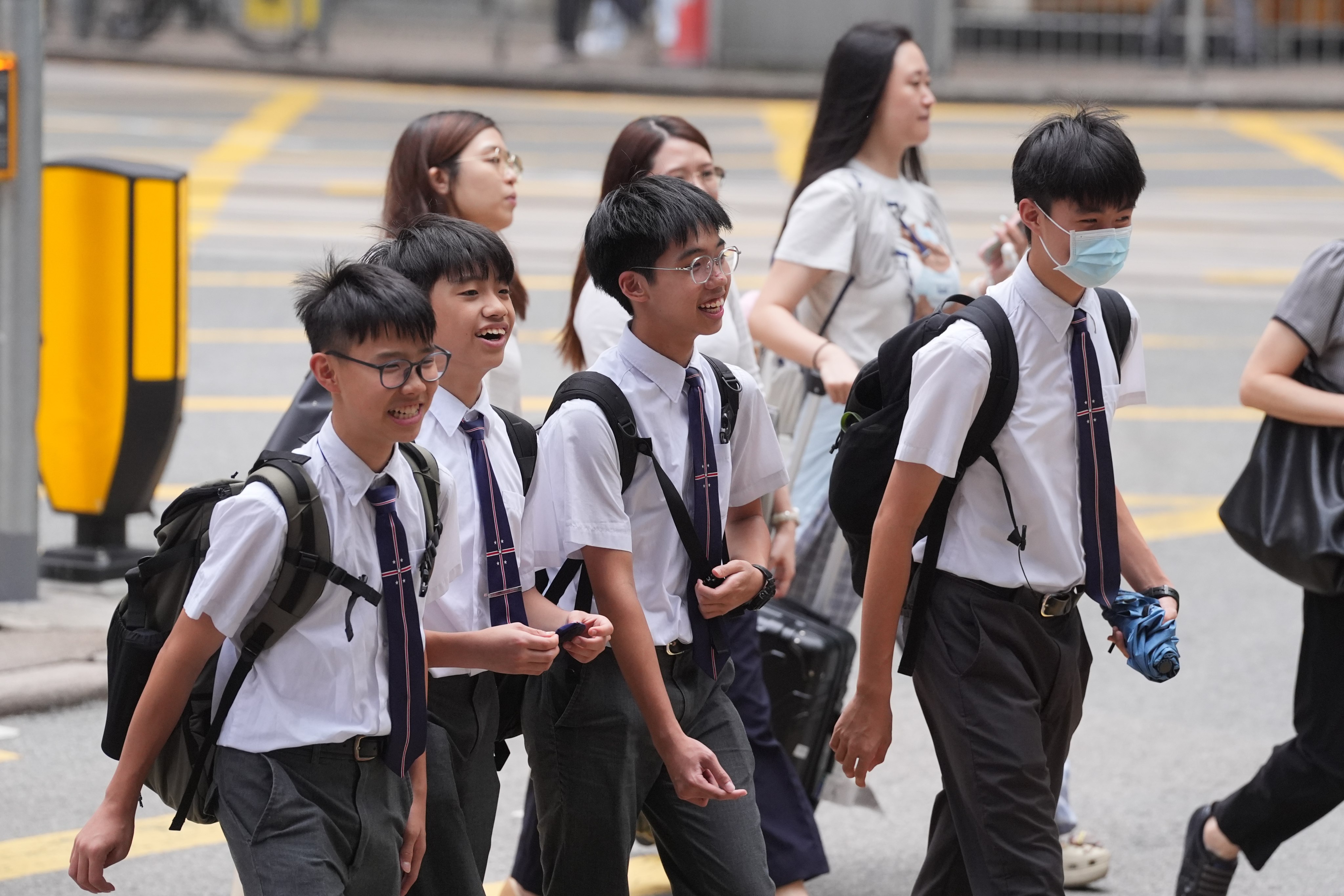 A group of students in Wan Chai. Many Hong Kong parents are opting to send their children to summer schools in Asia as airfares to previously popular Western countries have spiked. Photo: Elson Li