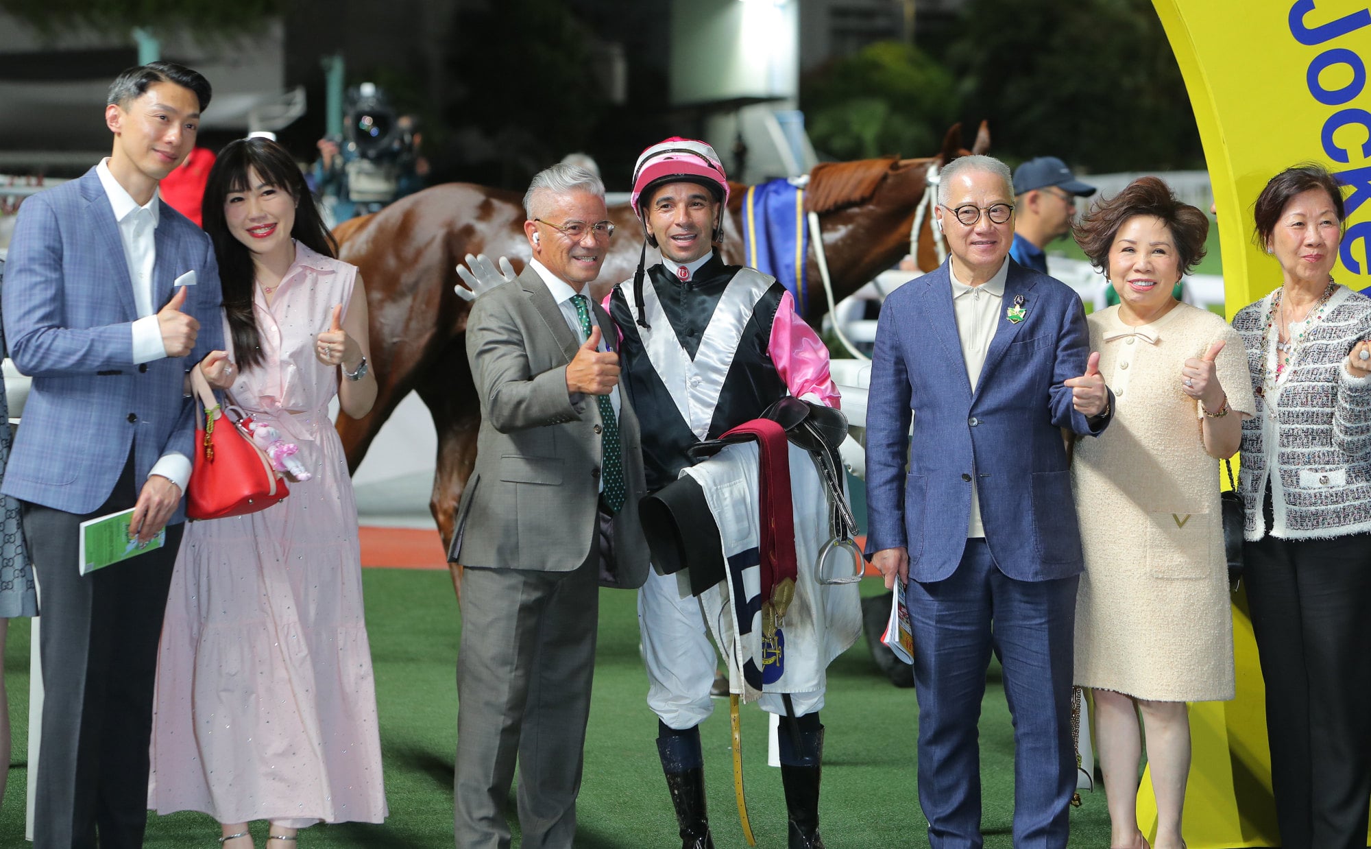 Trainer Tony Cruz (third left) and jockey Joao Moreira celebrate Beauty Joy's victory.