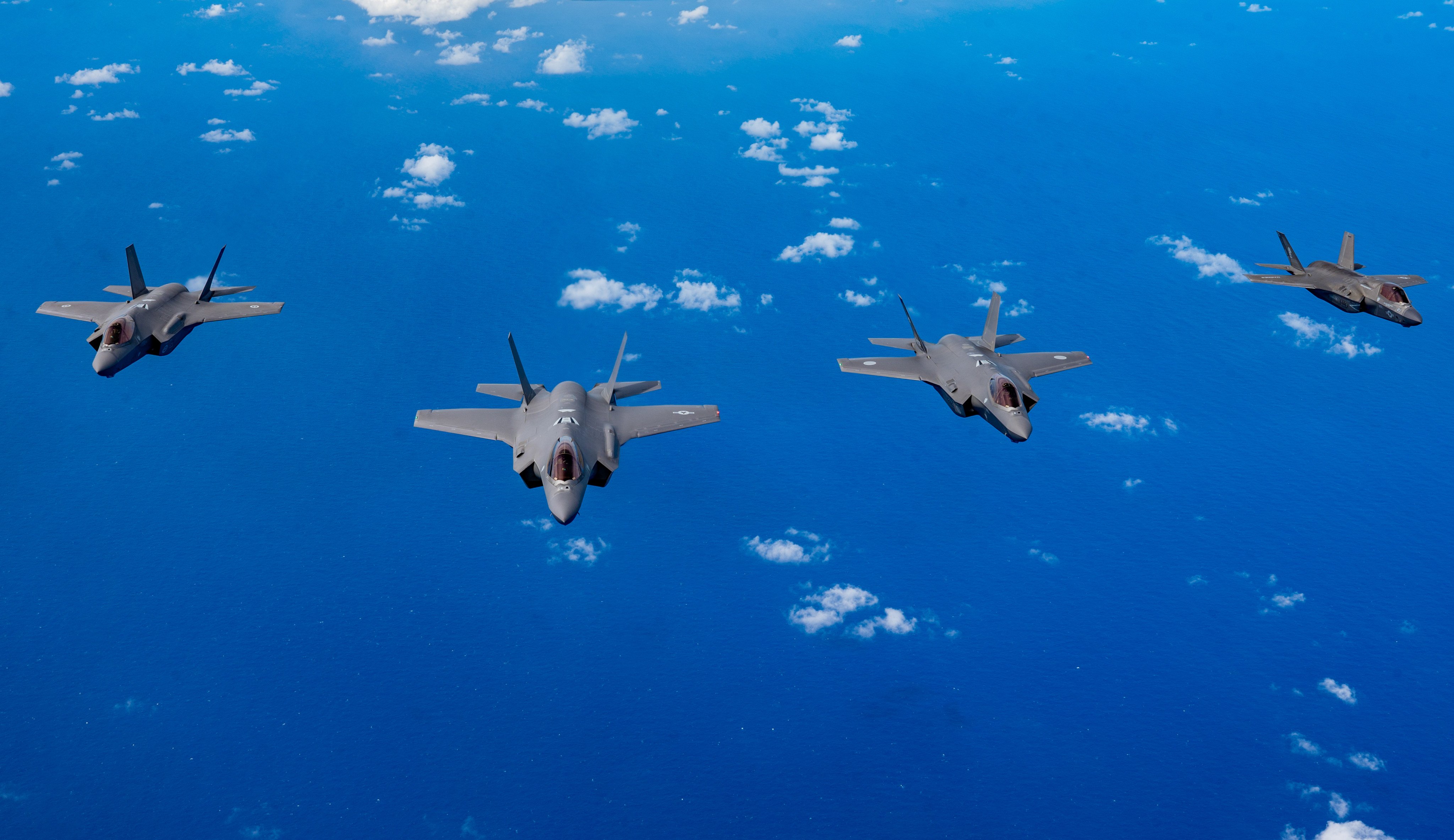 From the left, a Royal Australian Air Force F-35A, a US Air Force F-35A Lightning II, a Japan Air Self-Defence Force F-35A, and a US Marine Corps F-35B Lightning II fly over the US Pacific Command area of responsibility during exercise Cope North on February 7. Photo: US Air Force