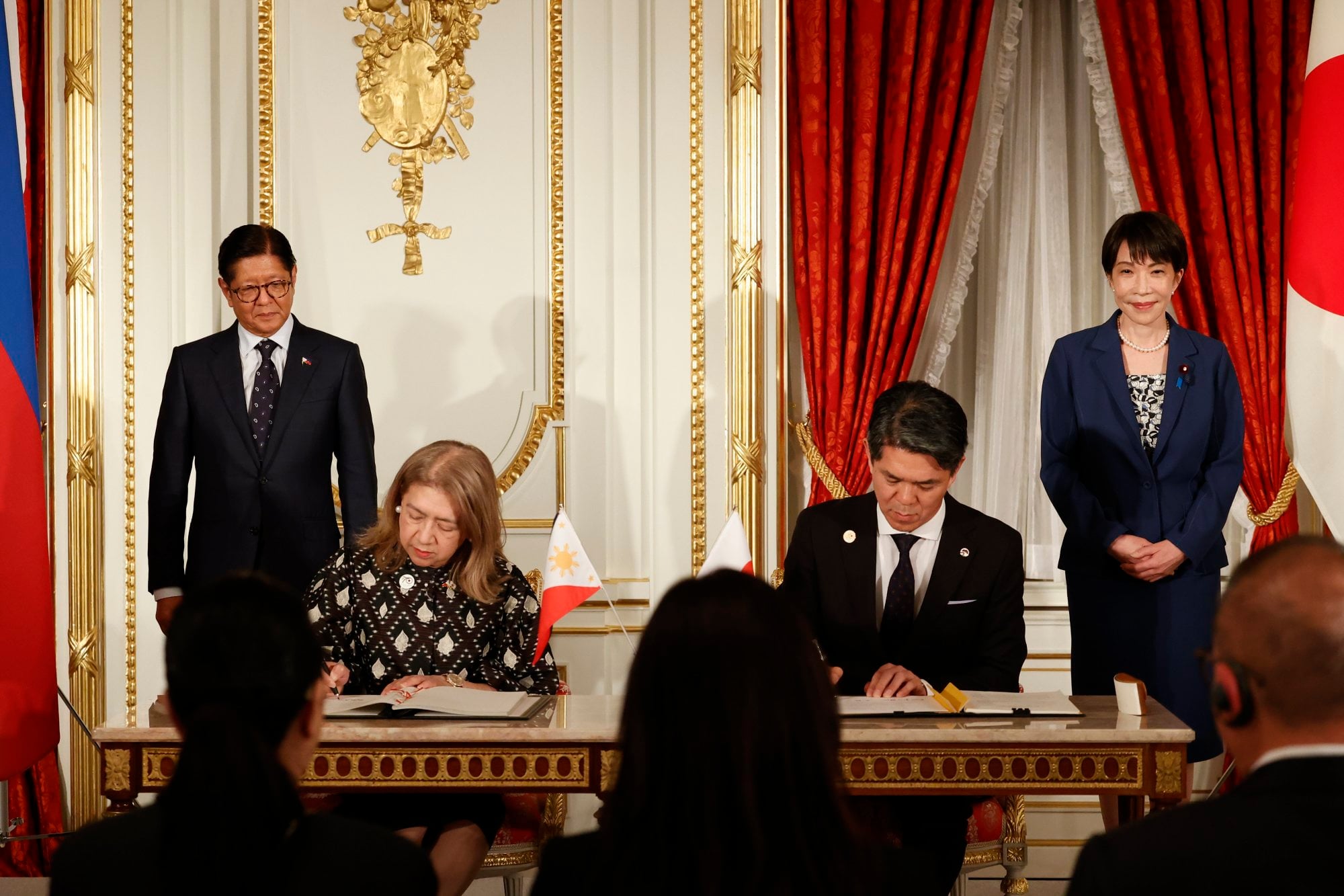Philippine President Ferdinand Marcos Jnr (standing left) and Japanese Prime Minister Sanae Takaichi (right) attend a cooperation agreement ceremony in Tokyo on May 28. Photo: EPA