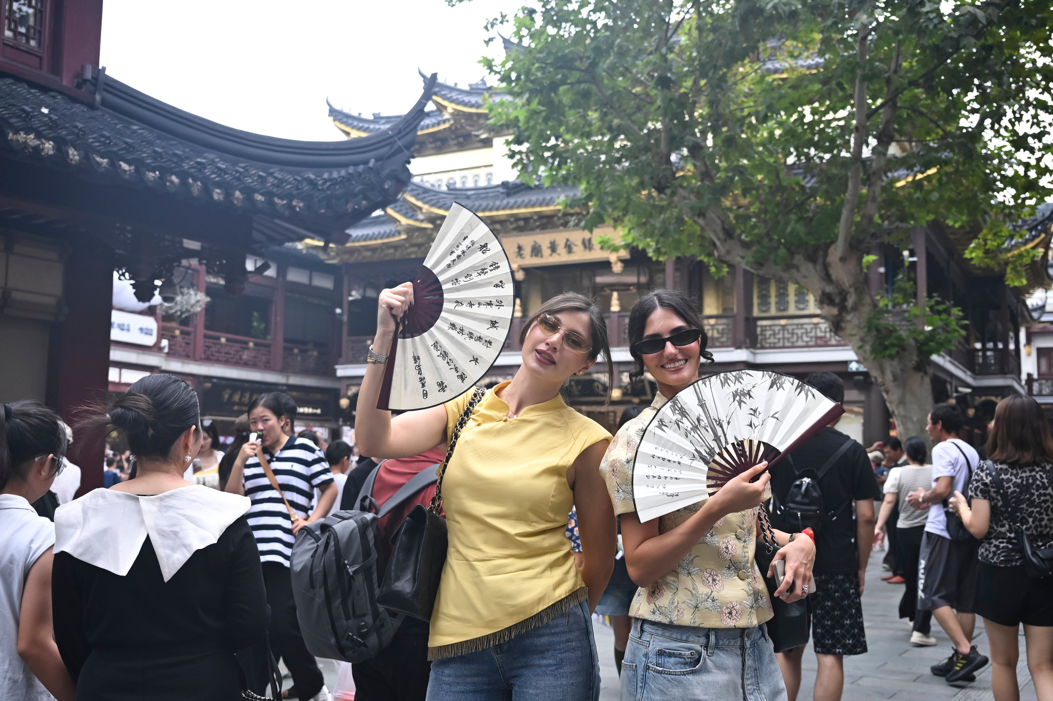 Russian visitors in Shanghai. A think tank is urging authorities to provide inbound visitors with app-loaded local phones to make easier payments in China  as their own overseas devices often lack those tools. Photo: Xinhua