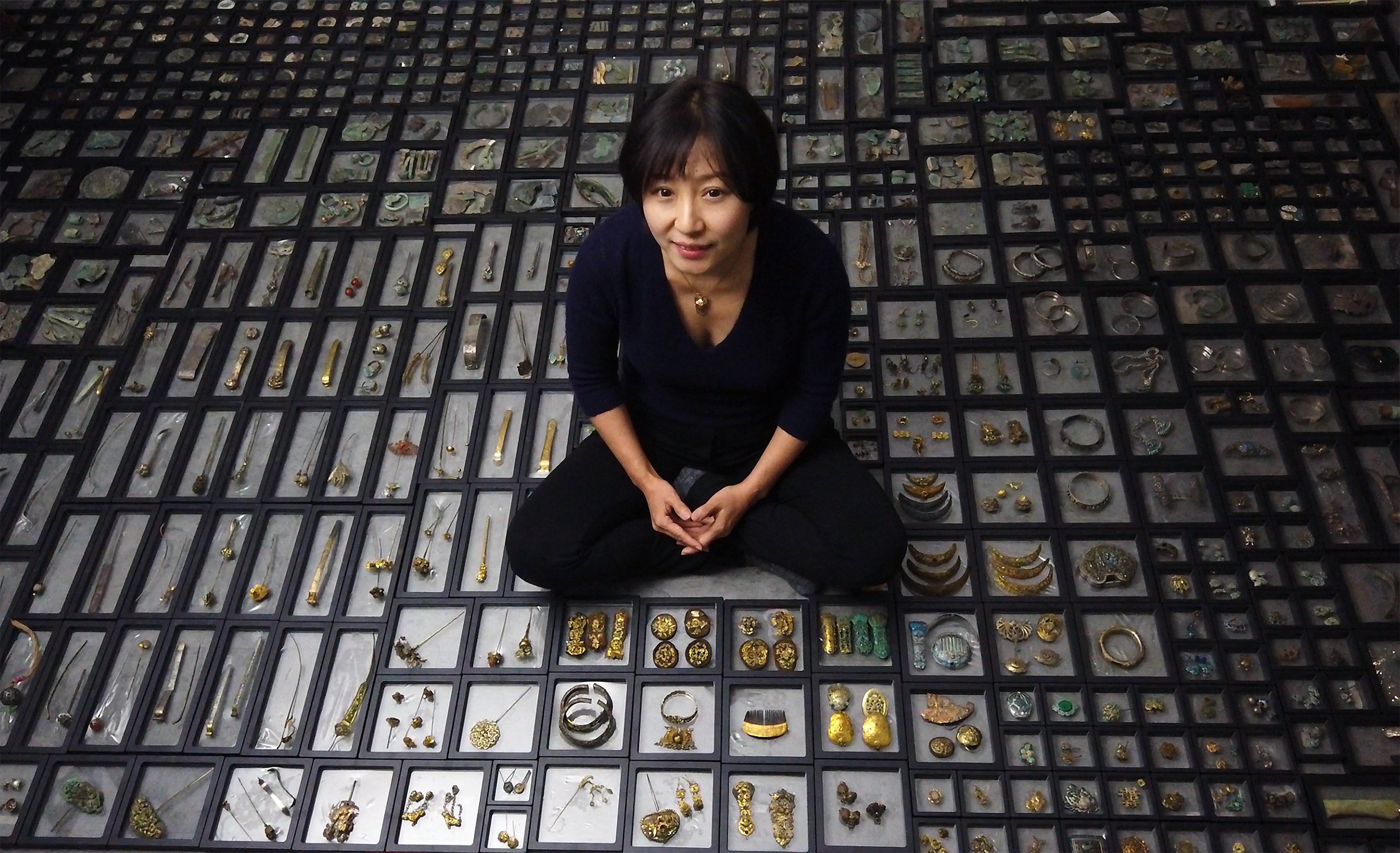 Chinese jeweller Huimin Zhang with her collection of antique jewellery. Photo: Handout