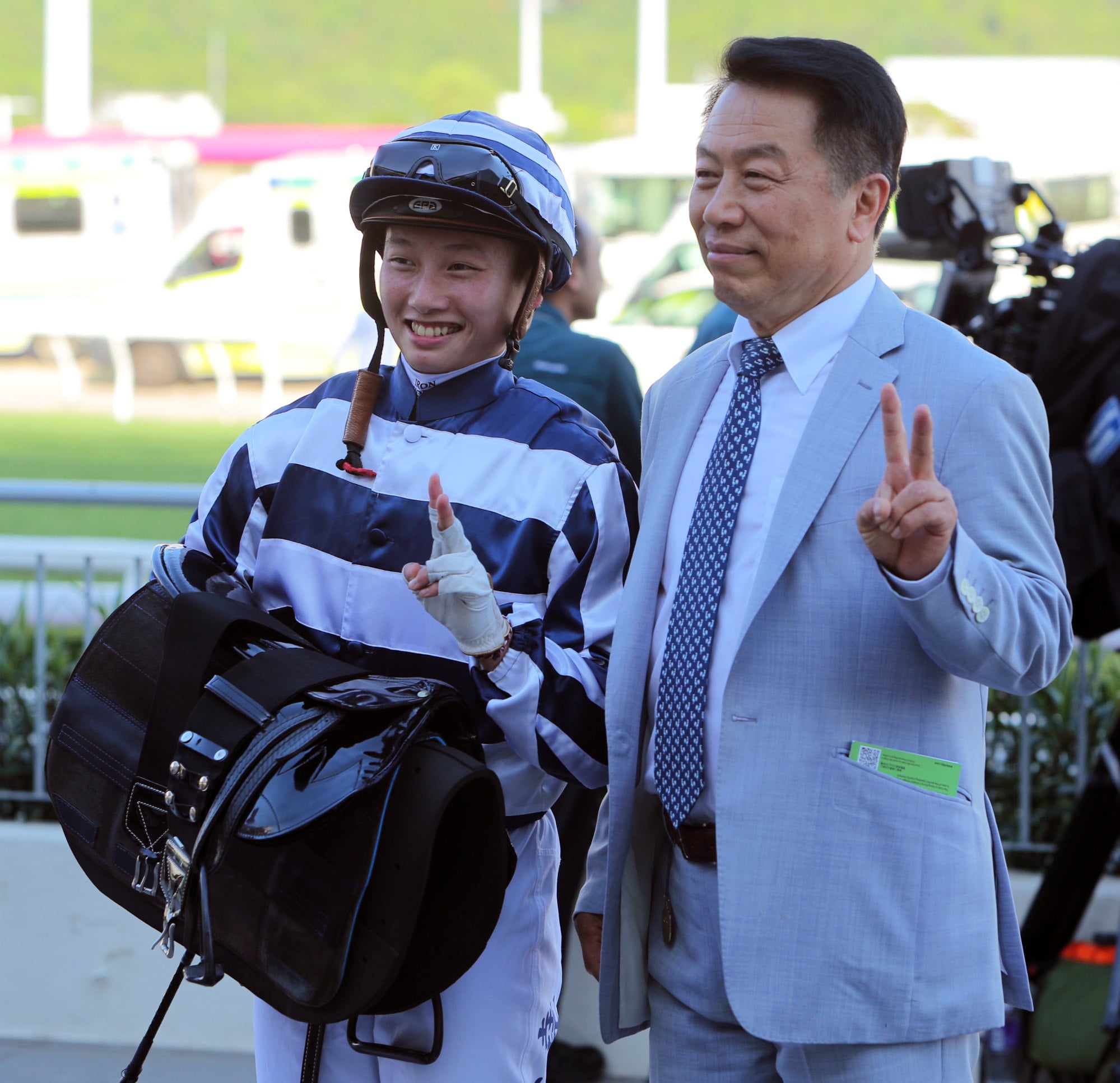 Nichola Yuen and trainer Ricky Yiu celebrate their Sha Tin double. Nichola Yuen and trainer Ricky Yiu celebrate their Sha Tin double.