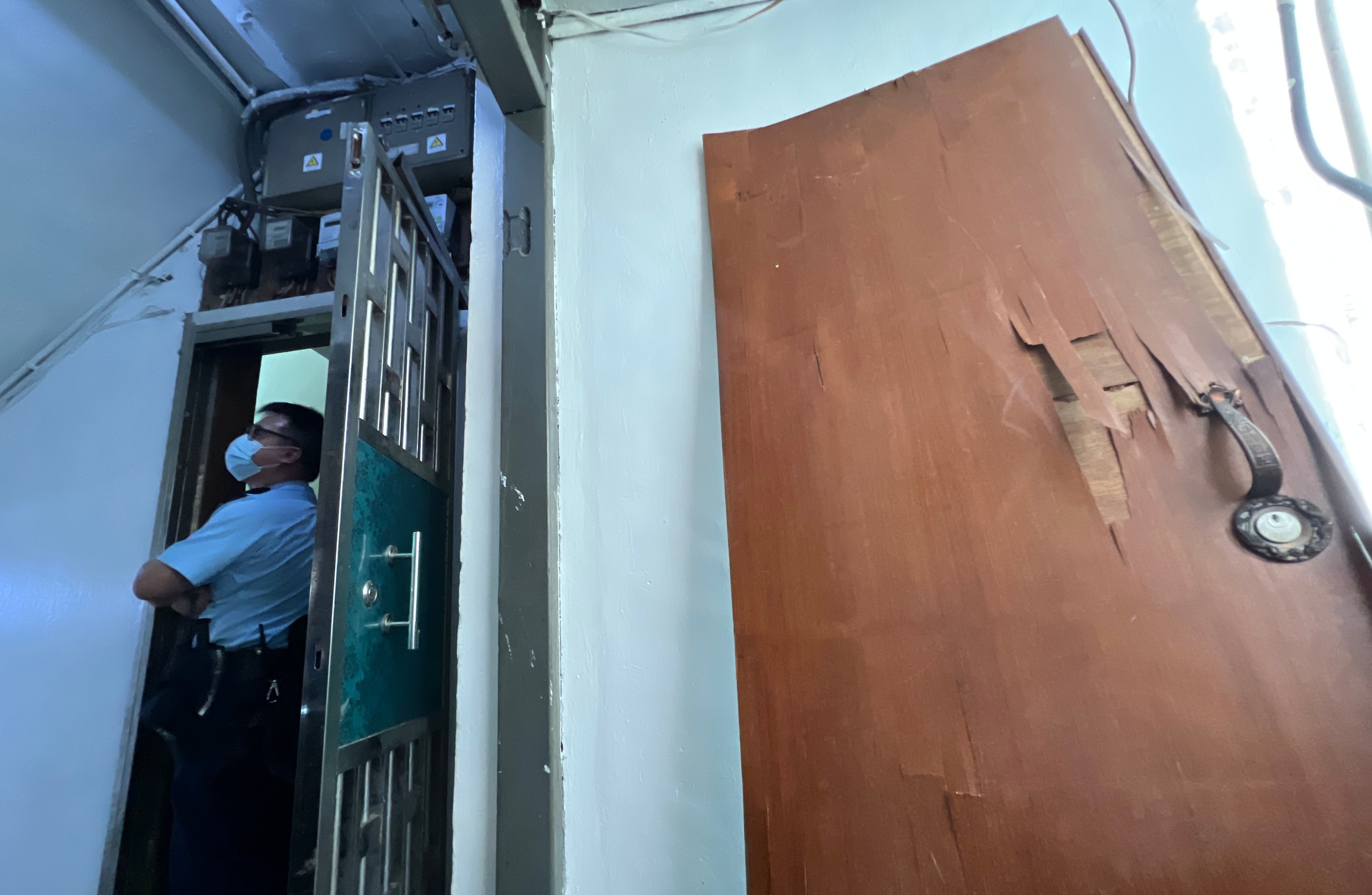 Police officers stand guard outside the residential flat where the boy died. Photo: Yik Yeung-man
