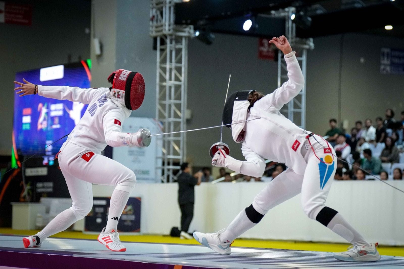 Kaylin Hsieh (left) in action in the women’s épée individual final in India. Photo: Handout