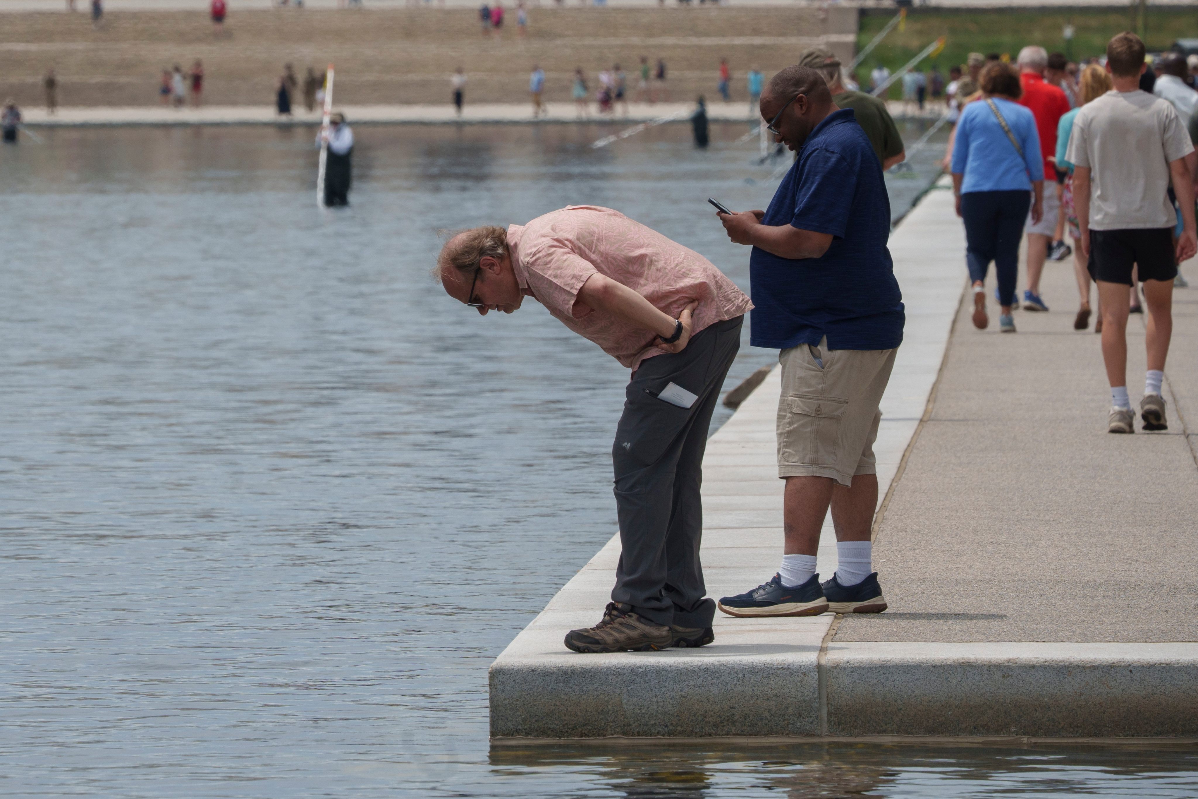 Visitors look into the pool. Photo: AP