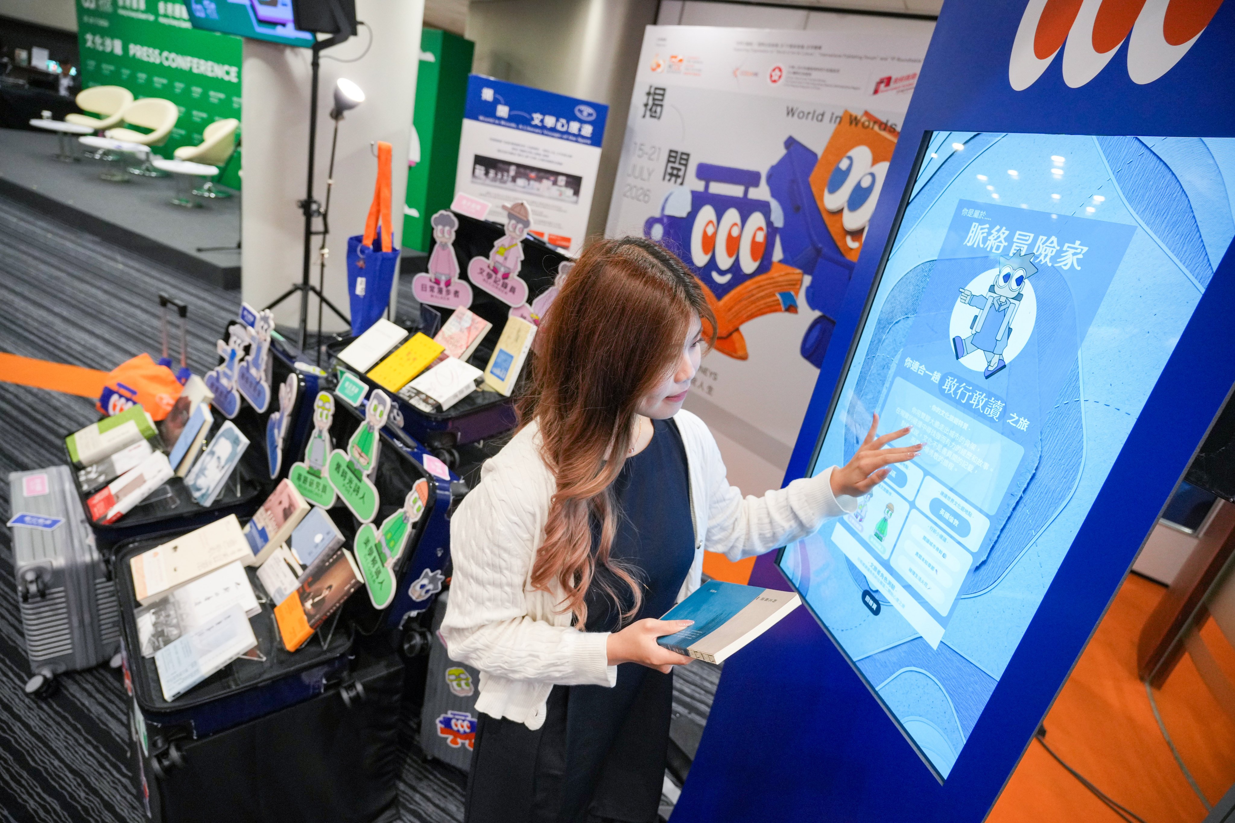 A worker prepares a display during a press conference for the Hong Kong Book Fair. Photo: May Tse