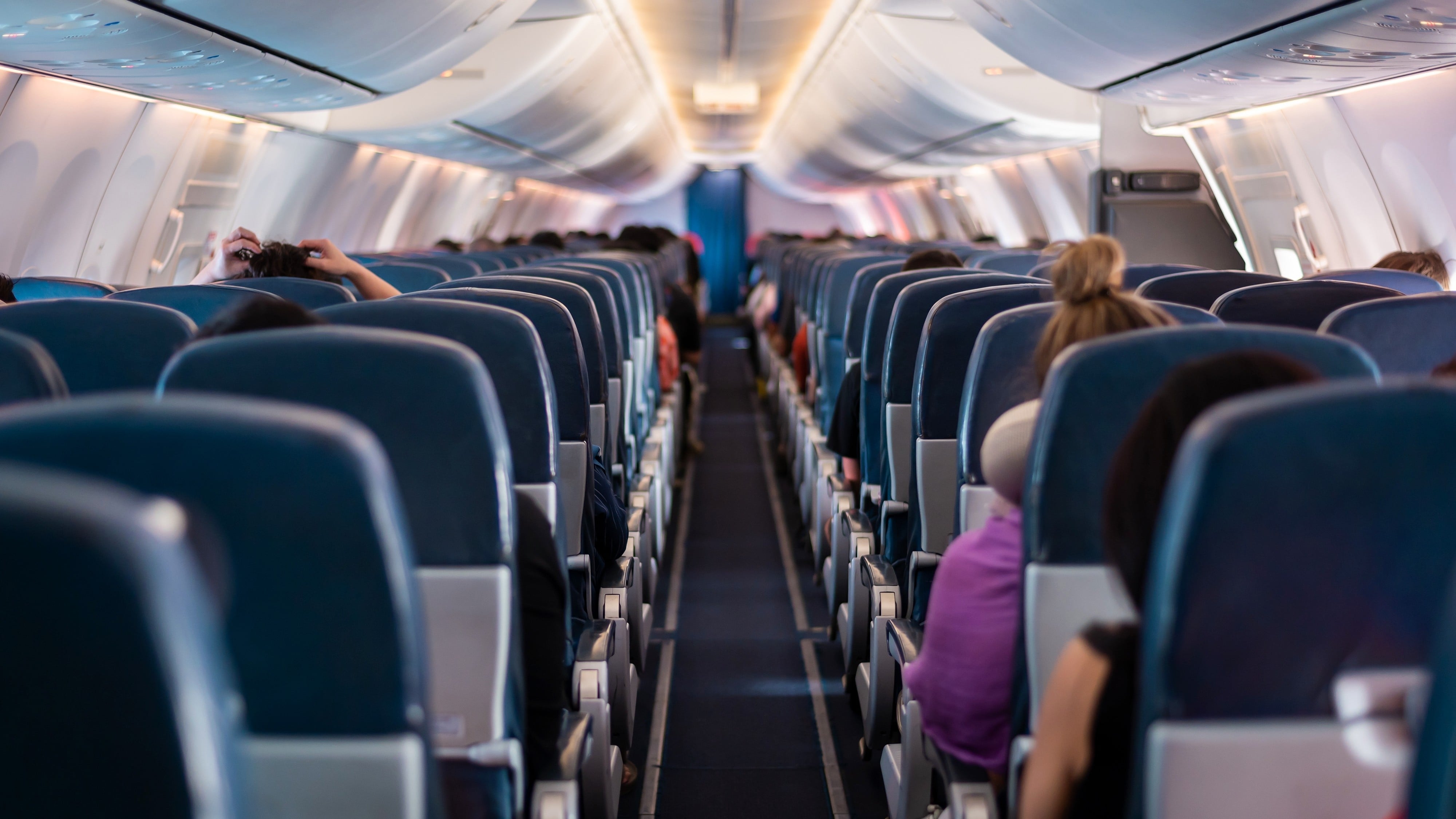 Discover why long-haul flights cause fatigue and learn some effective tips to stay energised and hydrated in the air. Photo: Shutterstock