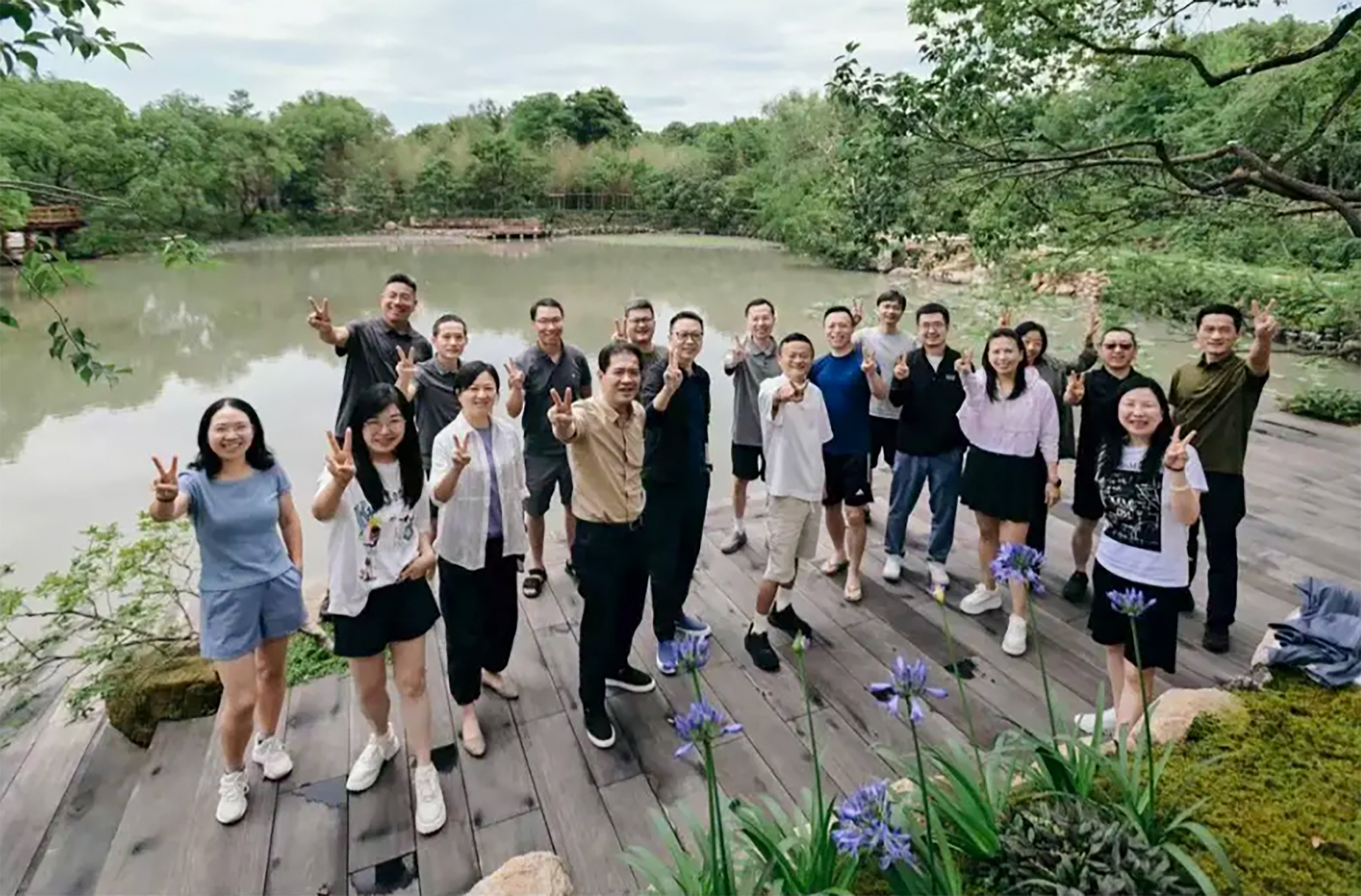 Jack Ma and Alibaba executives gather at the rice-planting team-building event. Photo: Handout