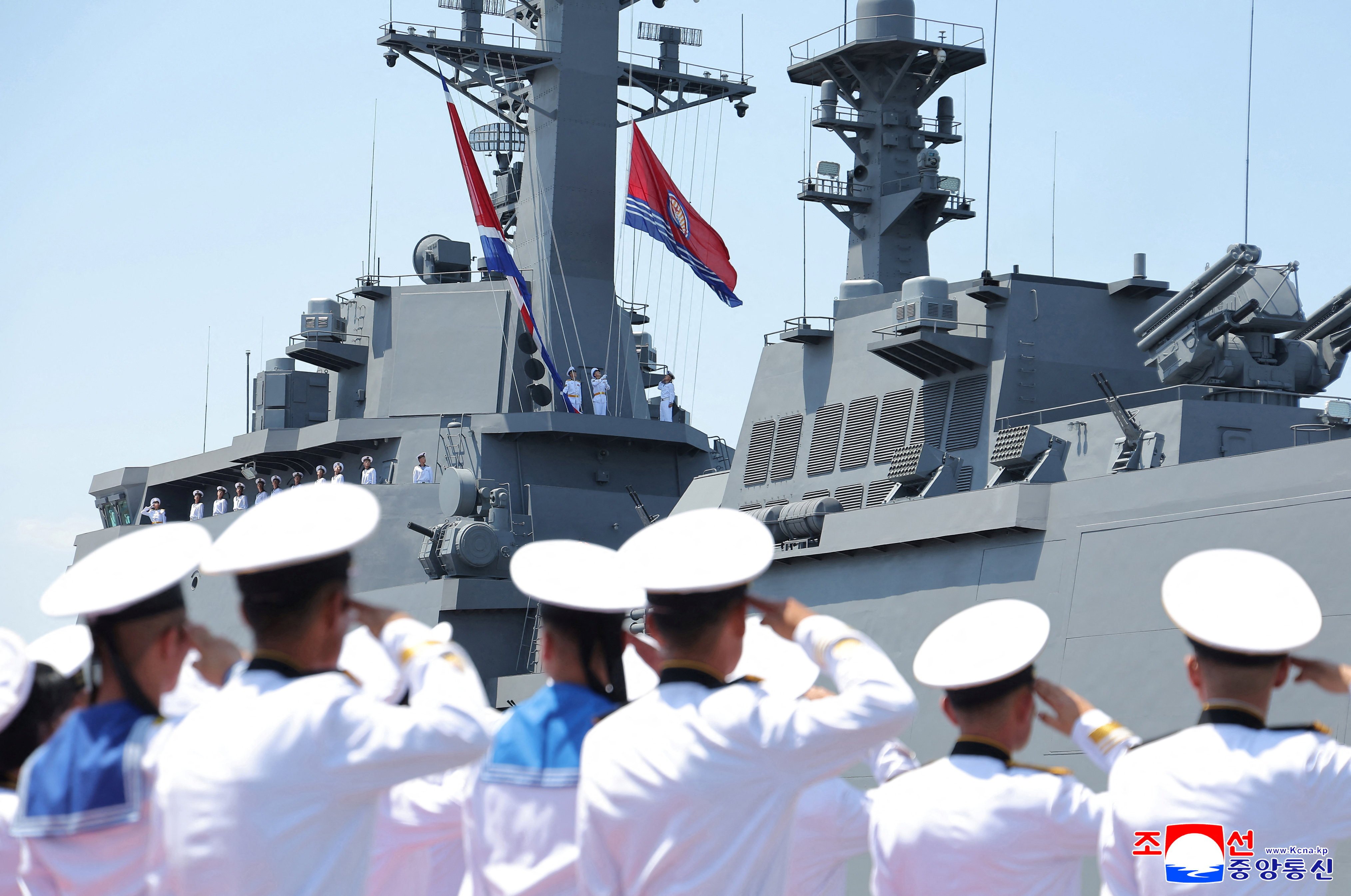 Sailors salute during the commissioning ceremony of the Choe Hyon warship in the port city of Nampo in North Korea on Wednesday. Photo: KCNA via Reuters