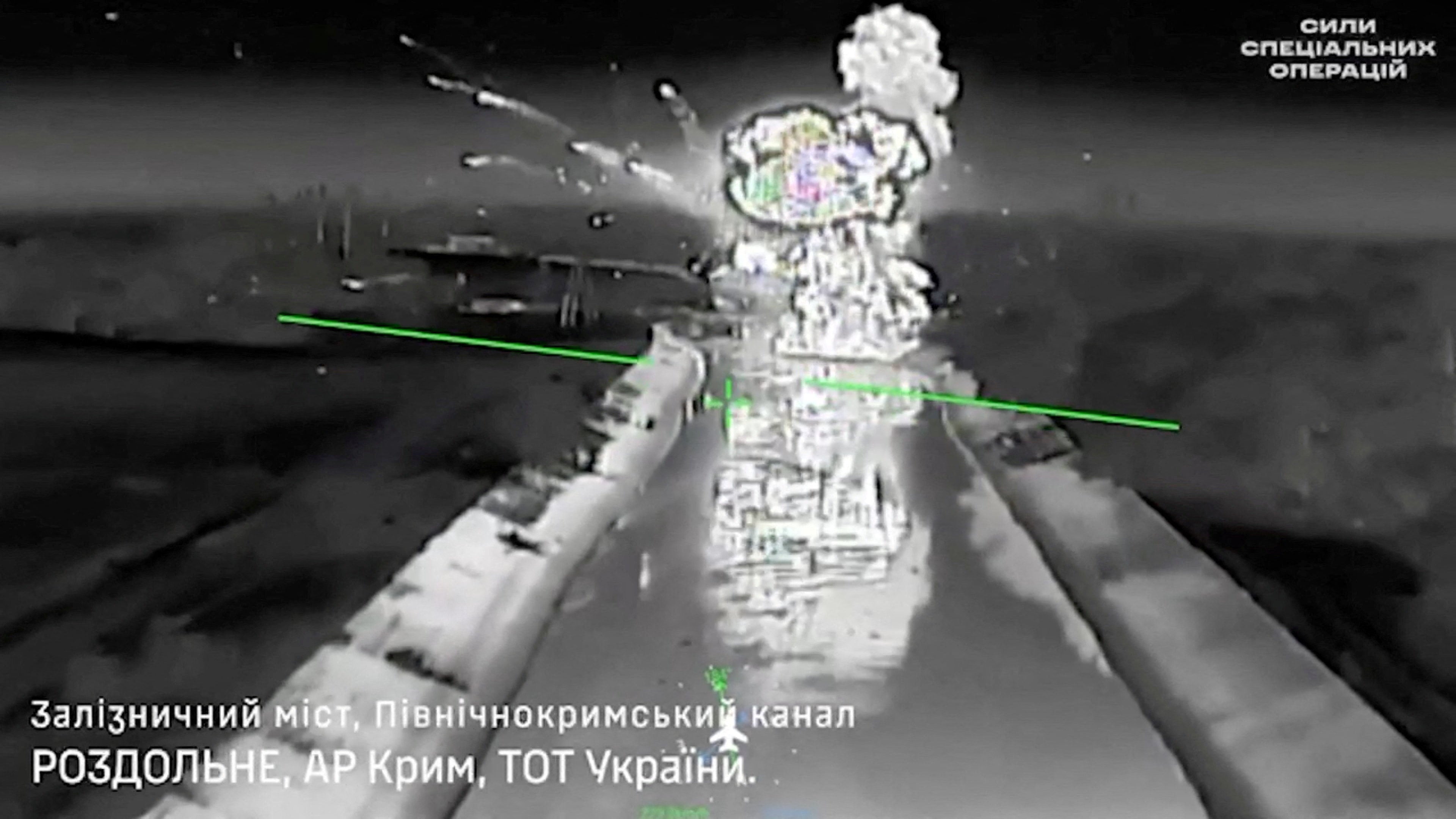 Drone footage shows fire and smoke rising from a bridge, which Ukraine's military says was destroyed by them, near Rozdolne, Crimea, in this screengrab from a handout video released on Tuesday. Photo: Reuters