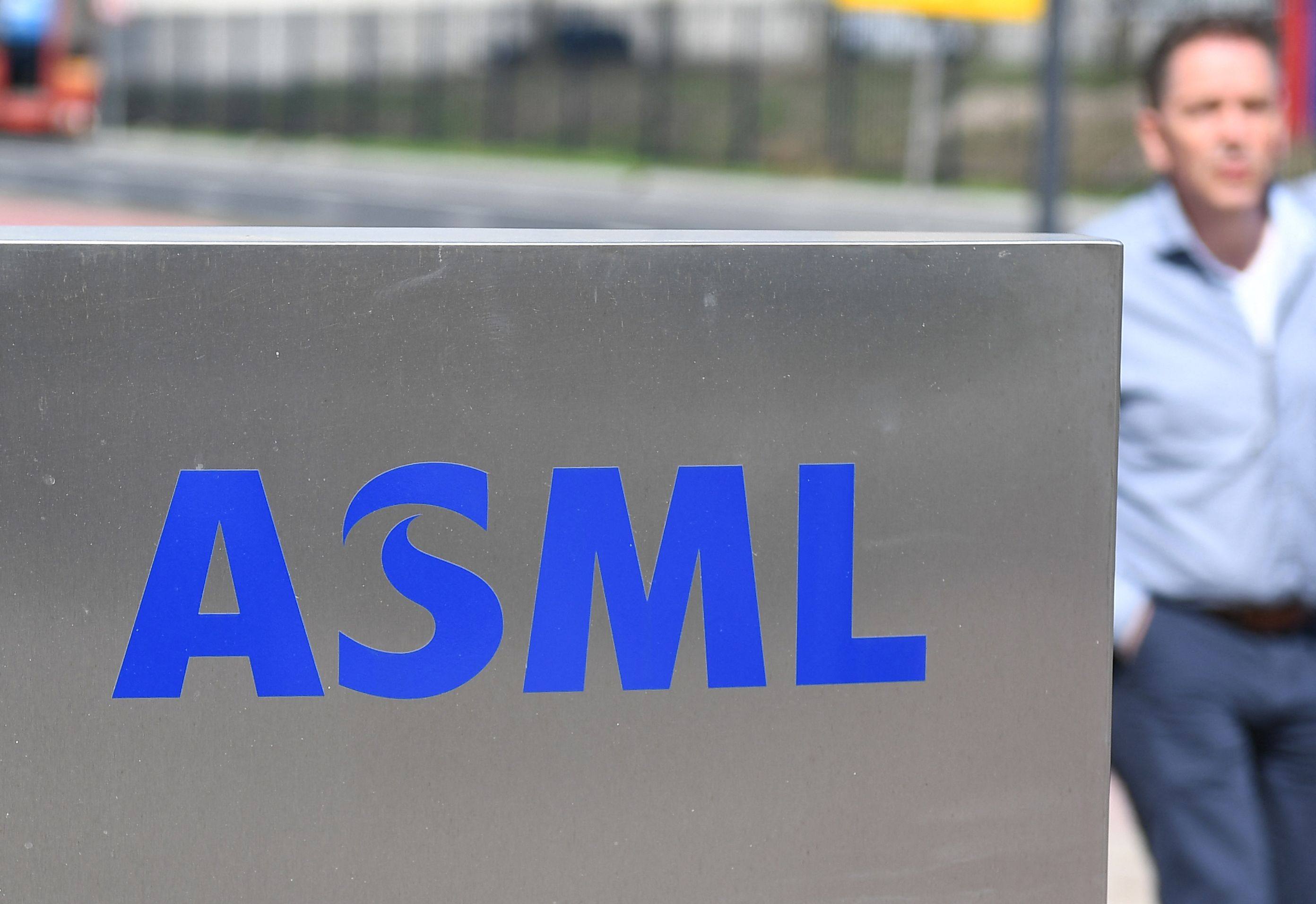 An employee walks past an ASML logo, the Dutch semiconductor equipment giant, at the company’s headquarters in Veldhoven on April 17, 2018. Photo: AFP
