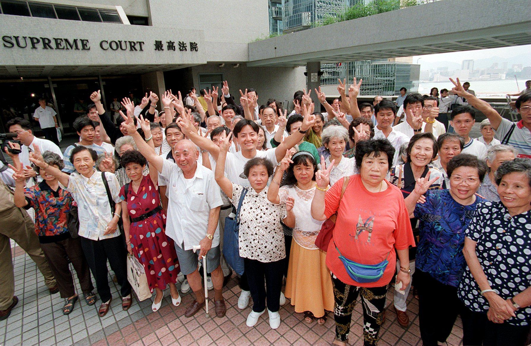 Rennie’s Mill residents celebrate outside the High Court after winning the court case on Jun 27, 1996. Photo: Robert Ng