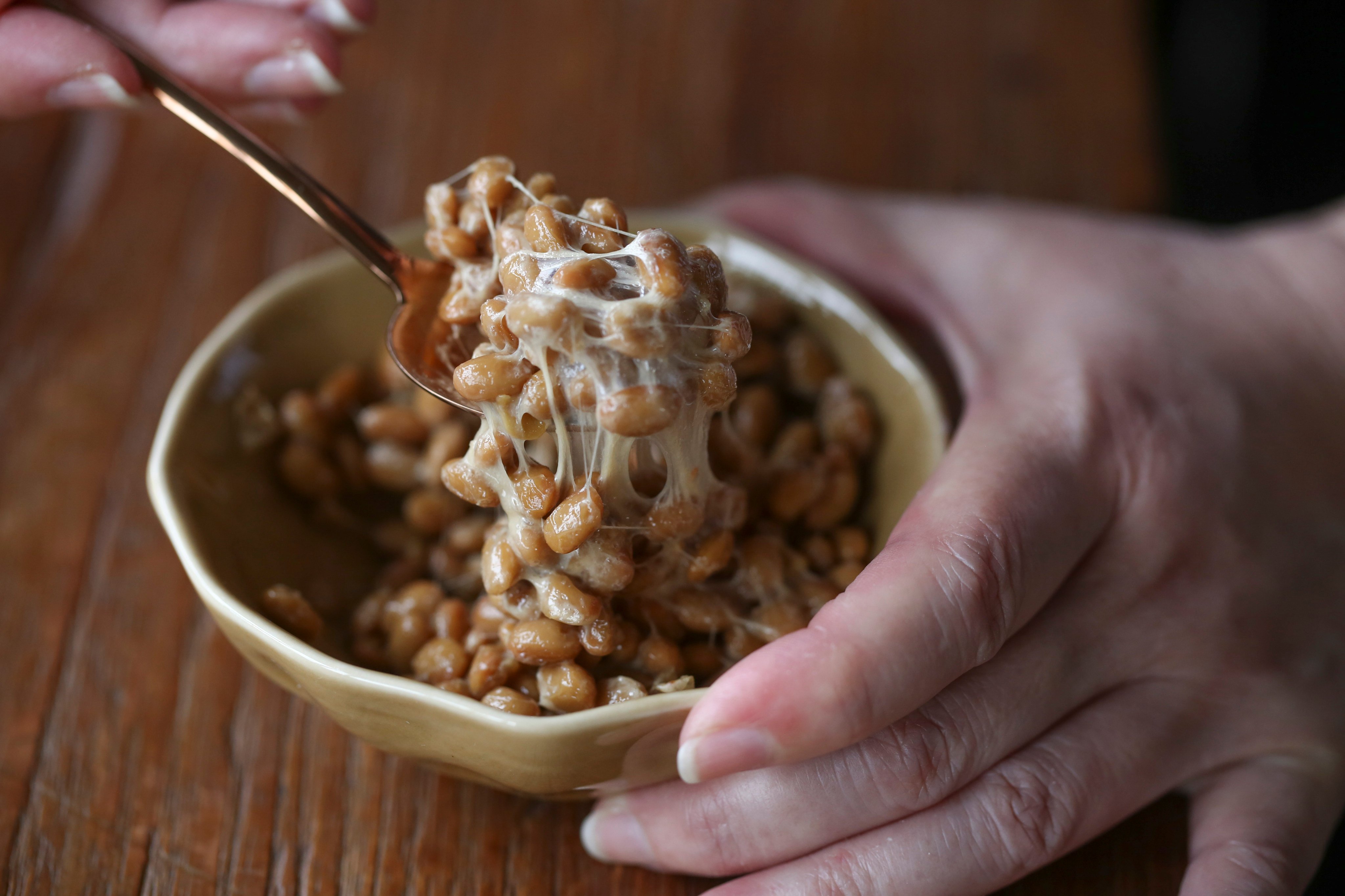 Soba noodles with grated mountain yam, okra, natto and poached egg - stirring the natto to make it stickier, by Susan Jung, in Hong Kong, May 28, 2020.  28MAY20 [FOOD SHOOT POST MAGAZINE]
SCMP: Jonathan WONG