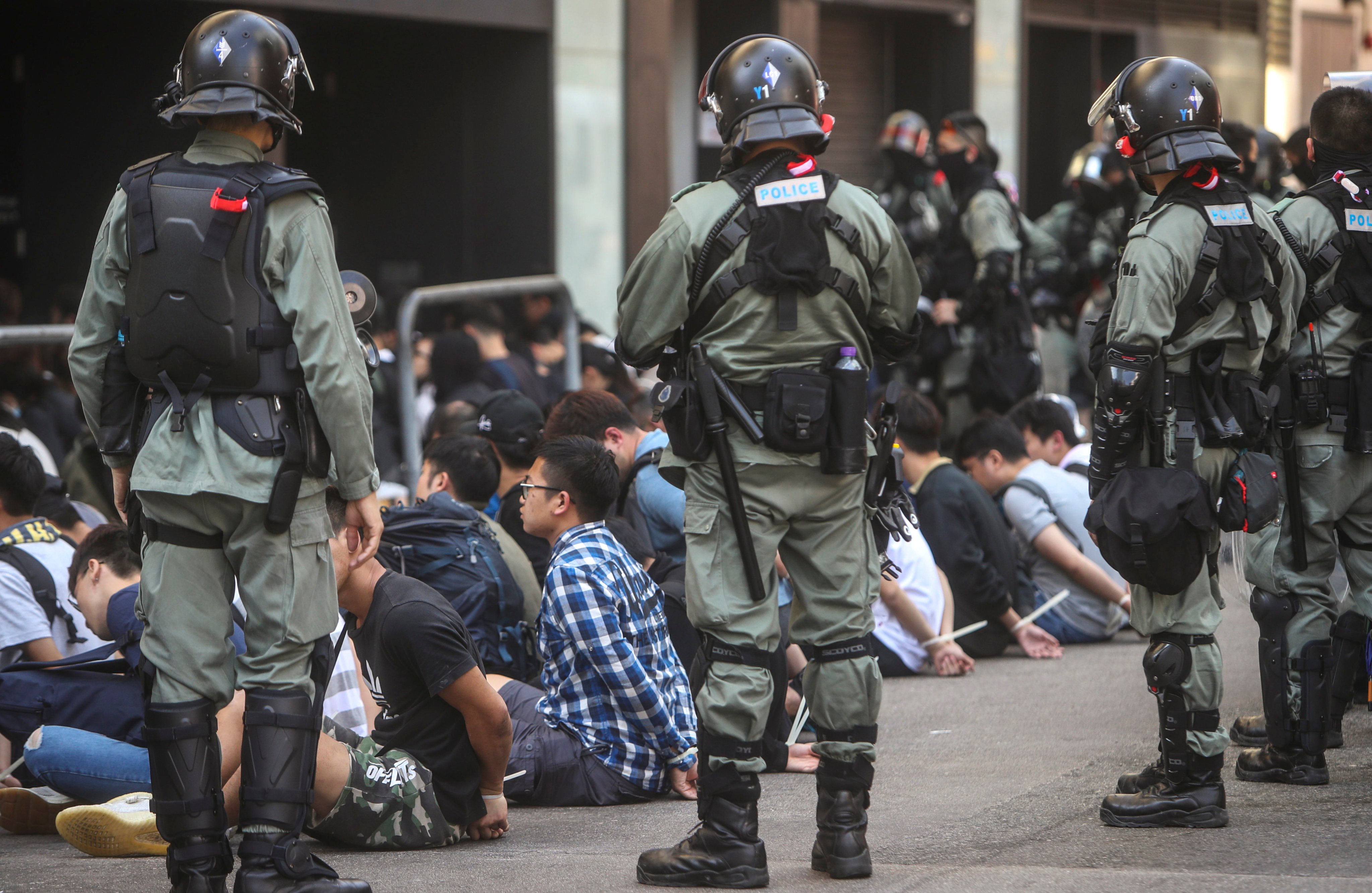 Riot police make arrests after clashes with anti-government protesters at Polytechnic University on November 18, 2019. Photo: Winson Wong