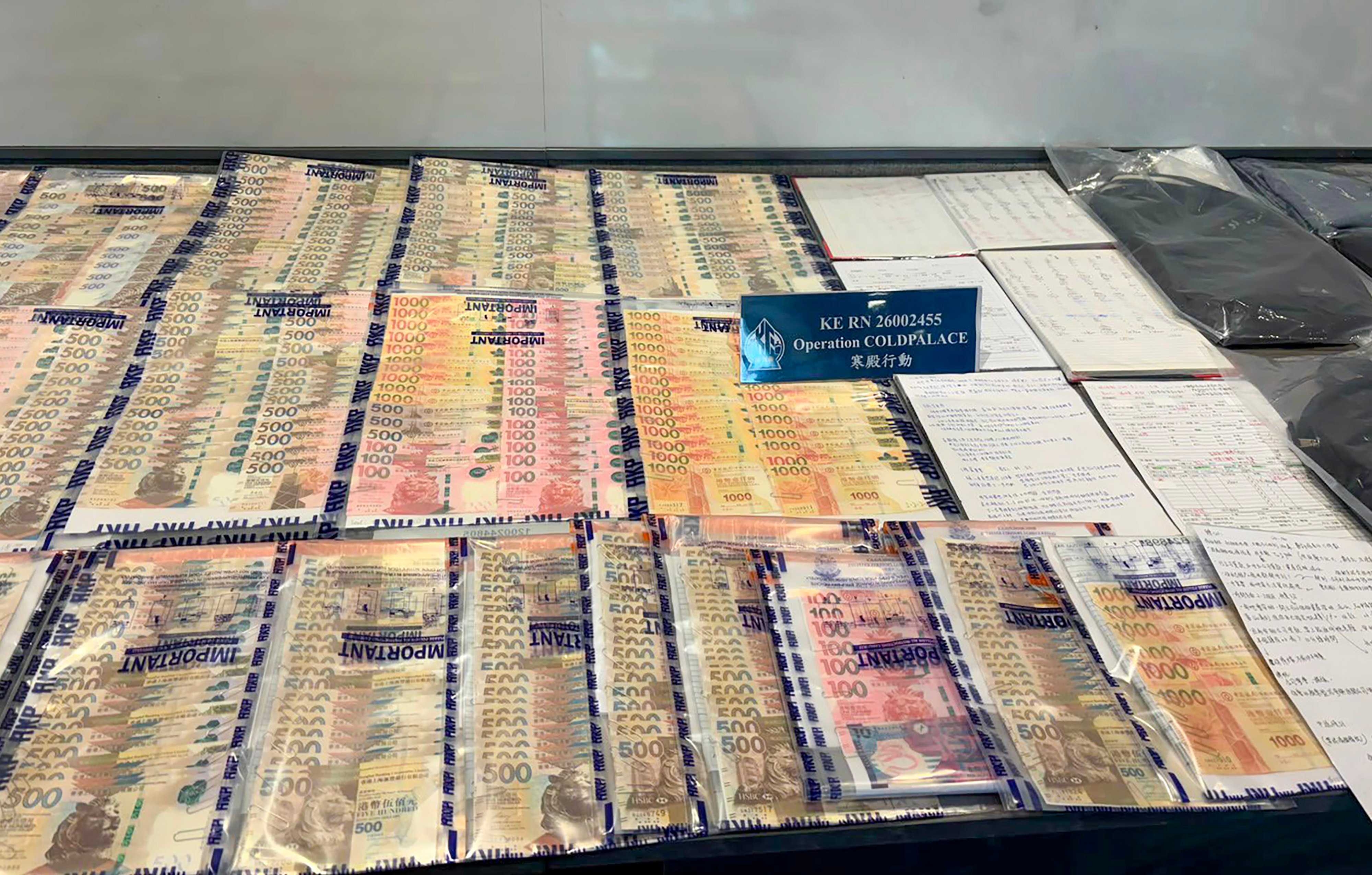 Police said they seized HK$300,000 in cash during the operation. Photo: Handout